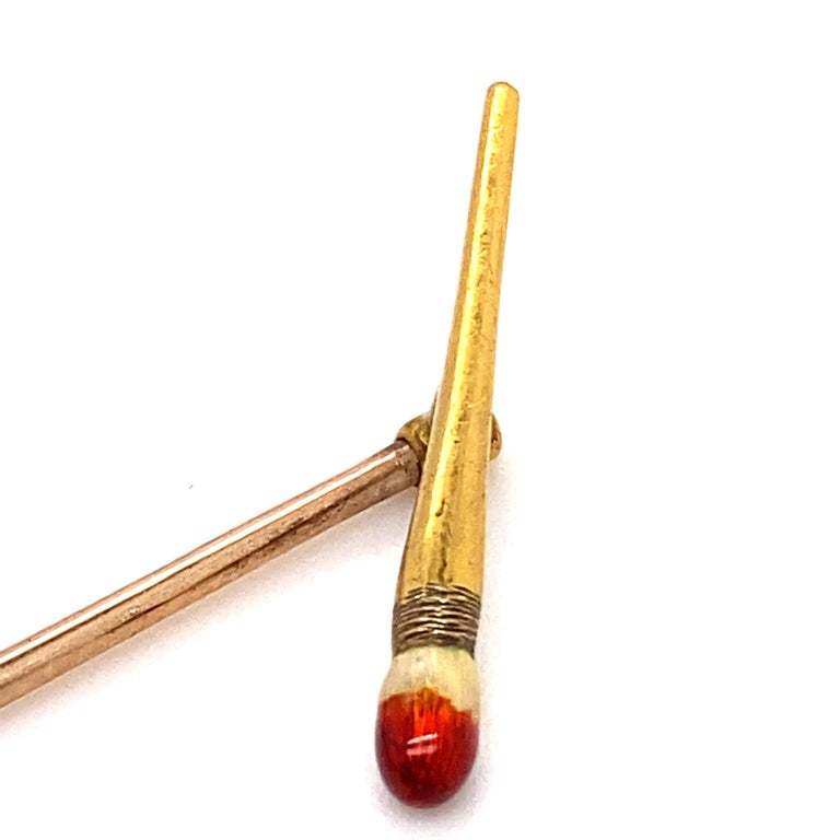 A vintage enamel paintbrush stickpin in 18 karat yellow gold, circa 1960.

This charming stickpin is formed as a realistic 18 karat yellow gold paintbrush, its end dipped in dark red paint, this depicted in enamel. Sat atop a polished yellow gold