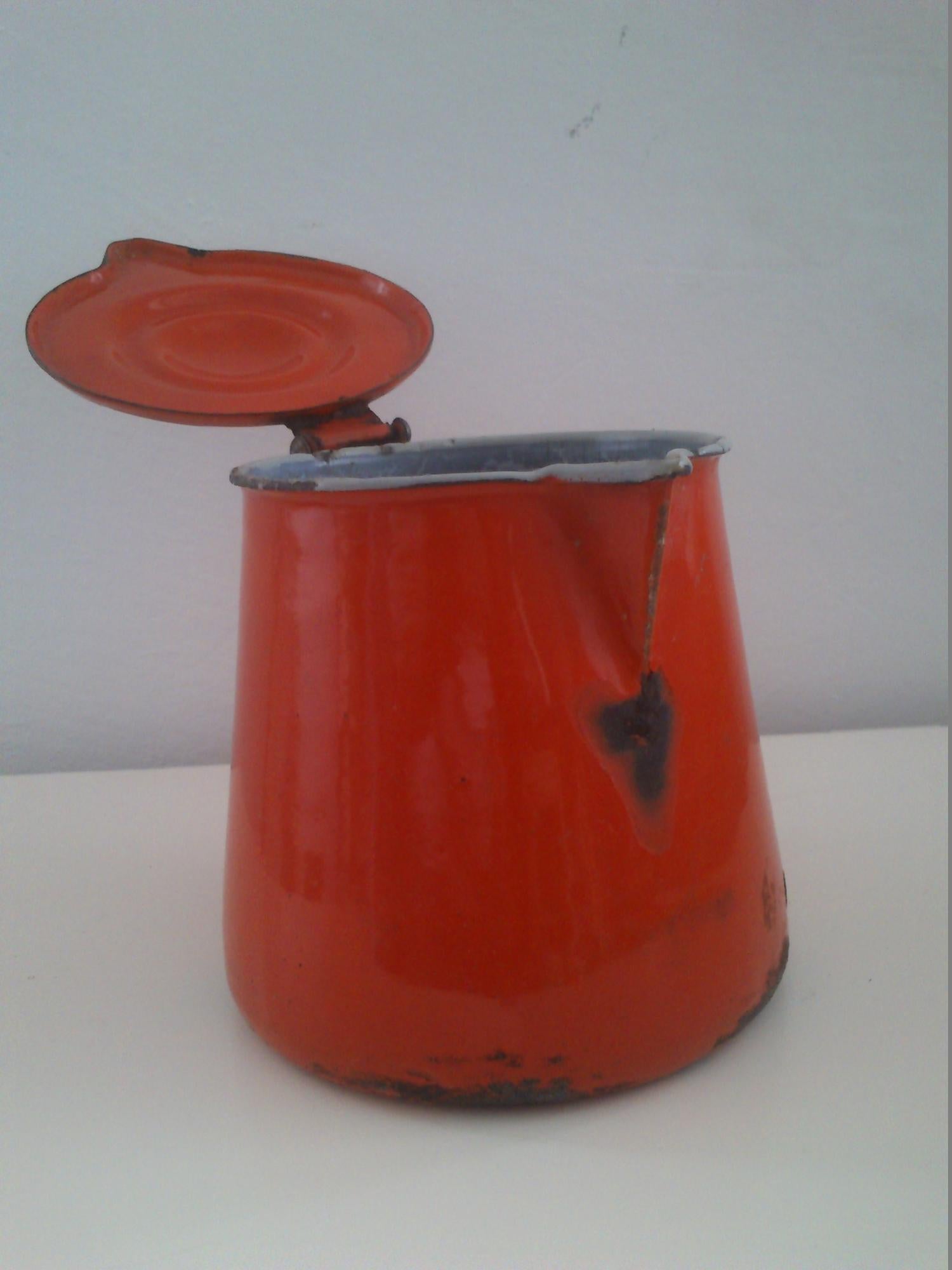 Vintage enamel pitcher with lid, circa 1950s.