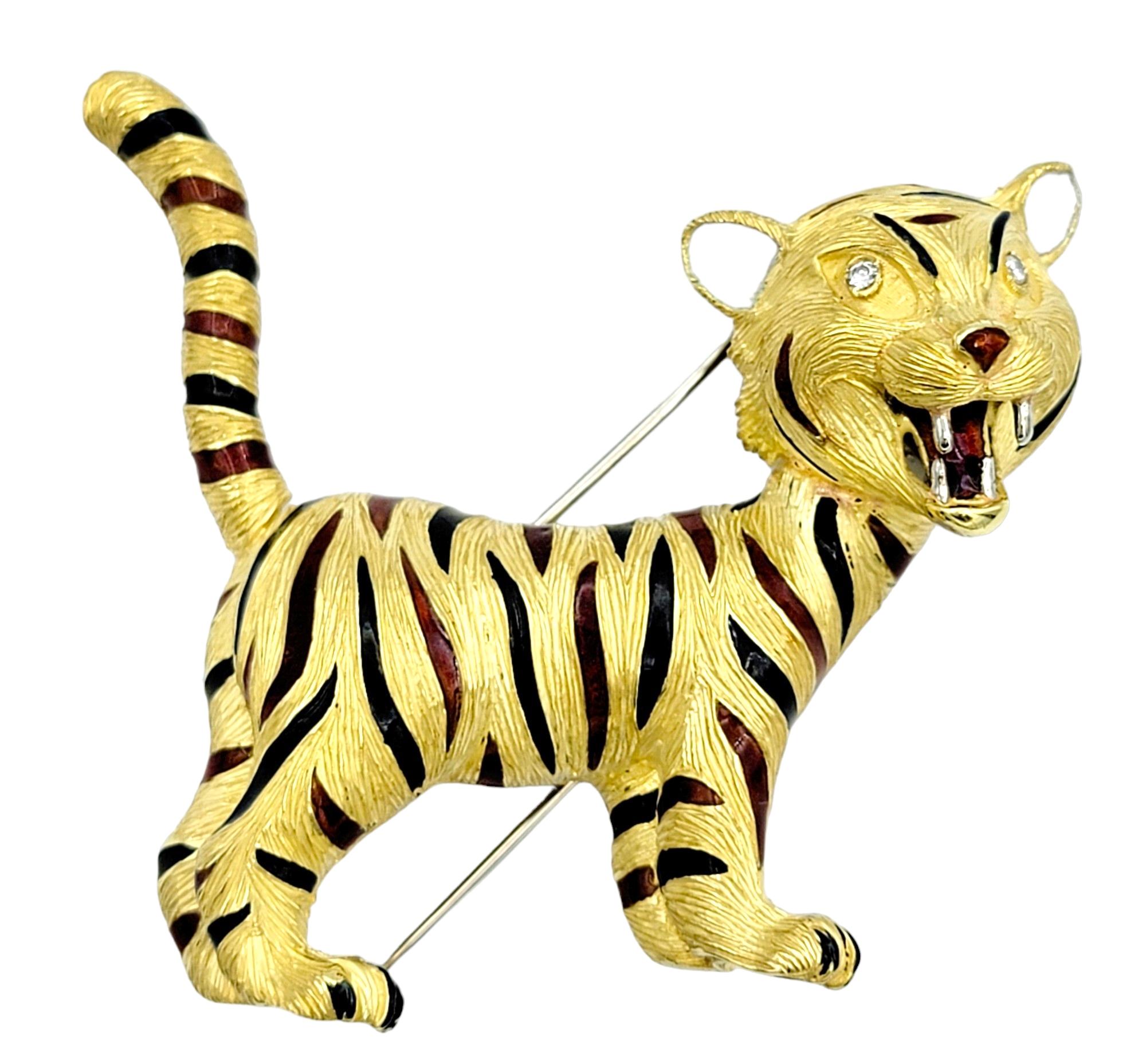 This captivating tiger brooch, expertly set in luxurious 18 karat yellow gold, is a testament to both bold design and meticulous craftsmanship. The striking depiction captures the majestic creature in a powerful stance, evoking a sense of movement