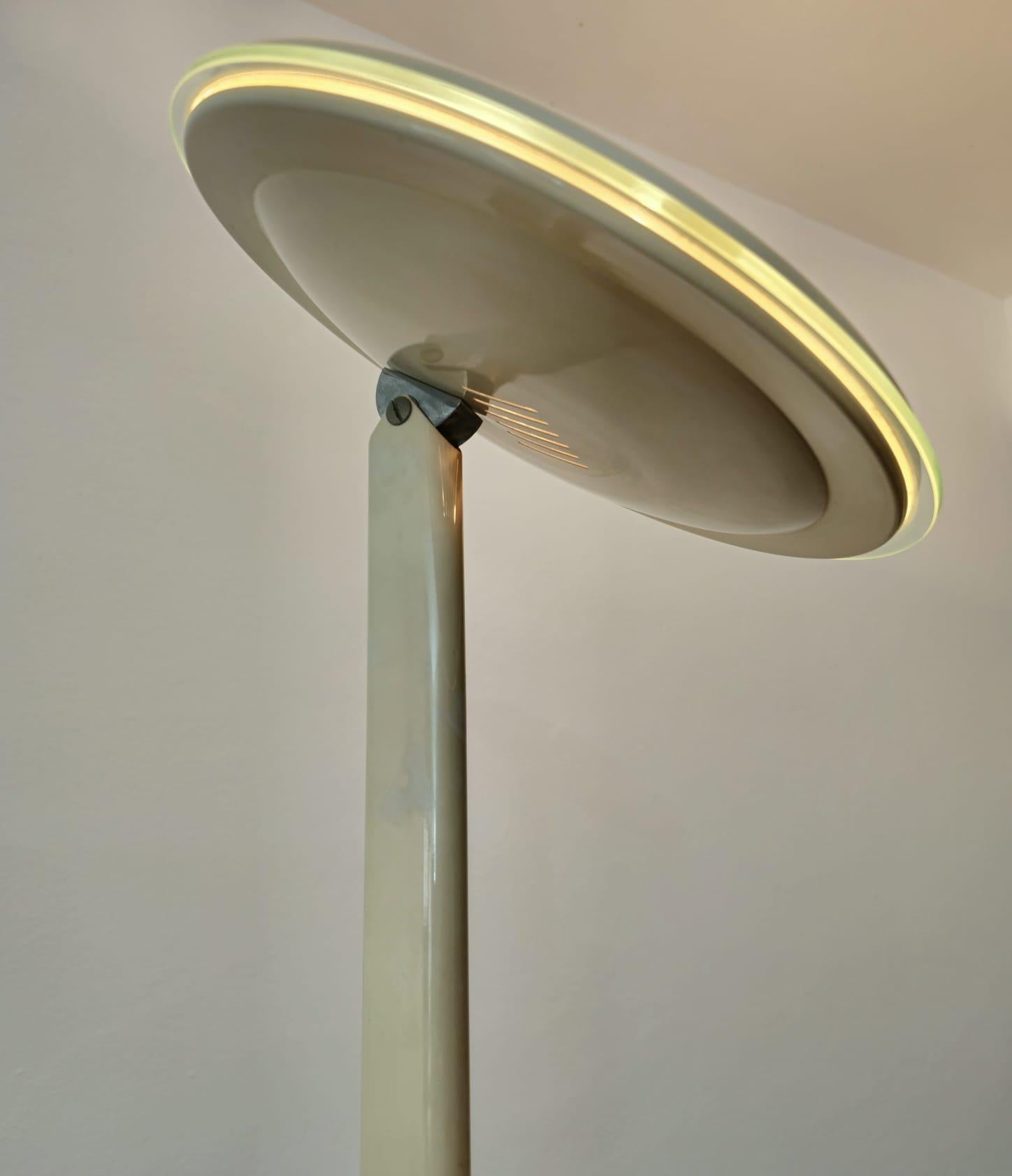 Vintage enamelled aluminum floor lamp, Italy, 1980s
Excellently made halogen floor lamp in beige enamelled metal with directional diffuser with circular transparent glass disc, which gives a touch of elegance. Produced in Italy between the 80s and