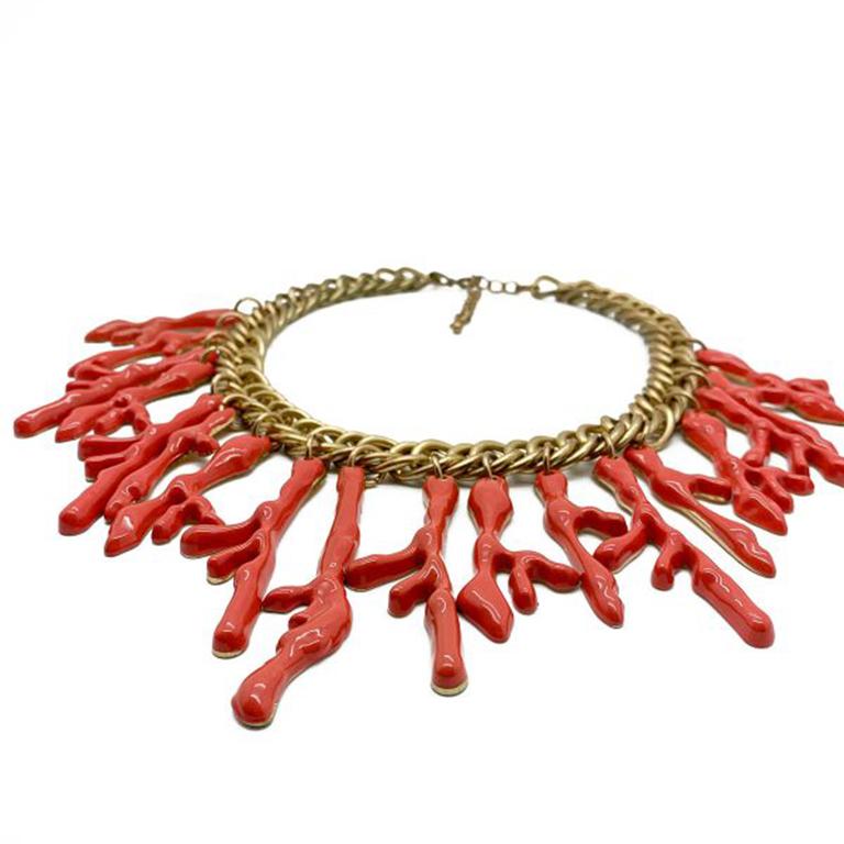 A Vintage Coral Bib Necklace with the most fabulous proportions and style. In the style of the now iconic Robert Goossens for Yves Saint Laurent coral collar which went on to inspire decades of coral jewel design. Crafted in gold plated base metal