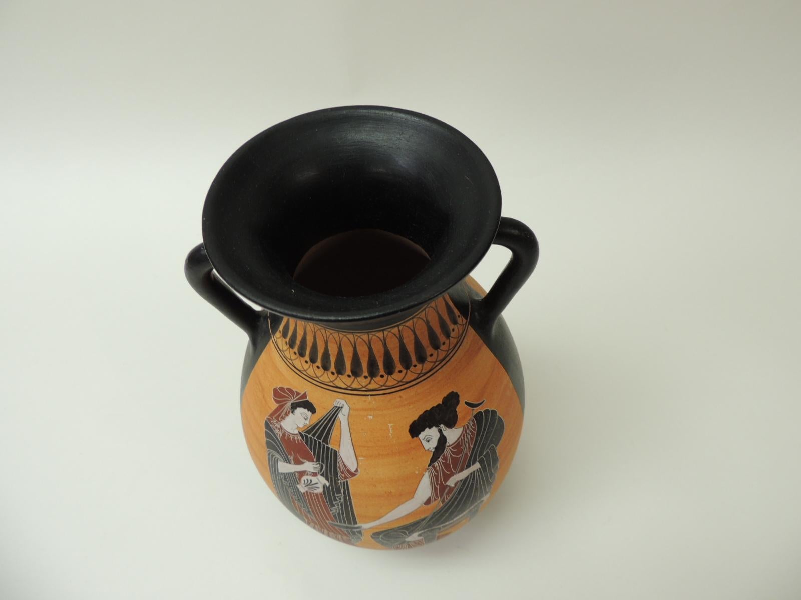 Vintage encaustic hand painted terracotta Greek water jug with handle. Tall hand painted jar depicting traditional Greek mythology figures and Greek key pattern in shades of white, black, pink, orange and gold. 
Encaustic painting, also known as