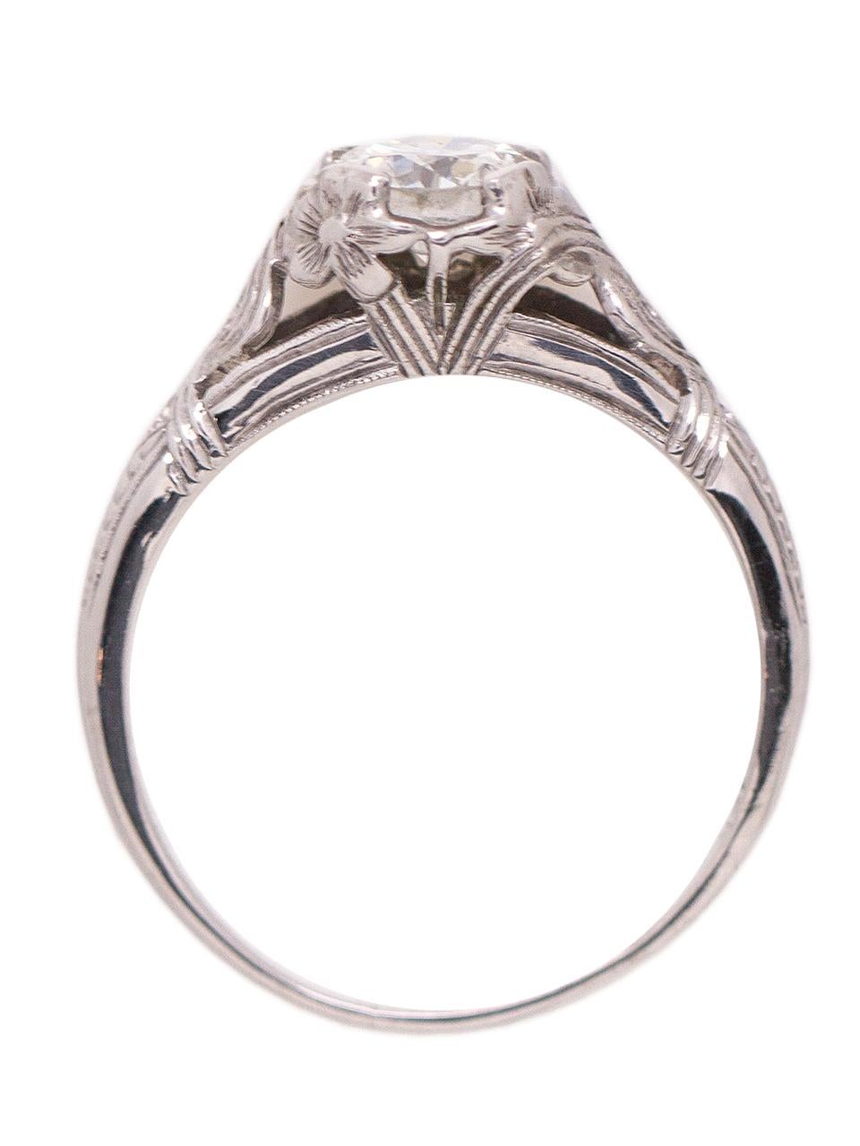 Lovely vintage 18k white gold diamond engagement ring featuring a stunningly bright 0.72ct Old European Cut center stone, H-VS1, set in a beautifully detailed hand pierced woven floral design setting dating from the 1920s. Classic wheat pattern