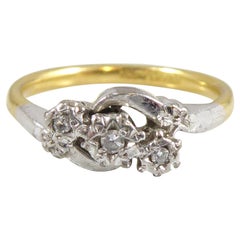 Vintage Engagement Ring Set with Three Diamonds in a Cross Over Twist Style