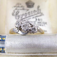 Vintage Engagement Ring Set with Three Diamonds in a Cross Over Twist Style