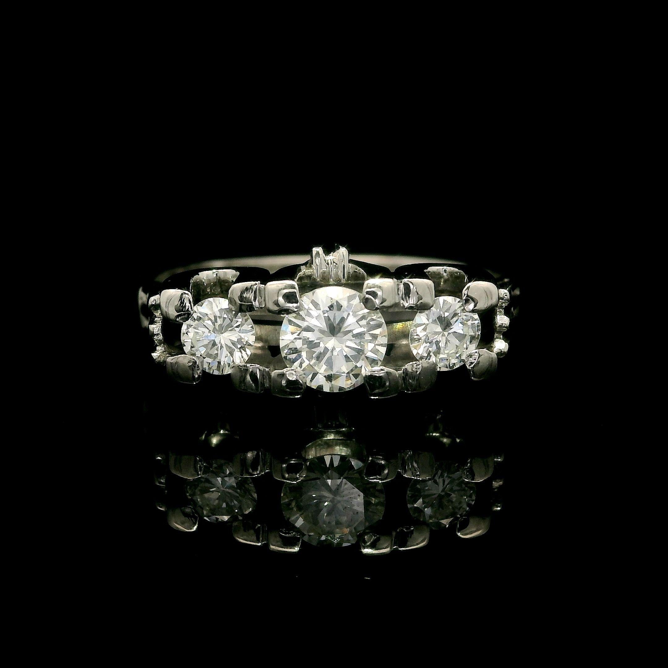 --Stone(s):--
(1) Natural Genuine Diamond - Round Brilliant Cut - Prong Set - VS1 Clarity - H Color - 0.40ct (approx.)
(2) Natural Genuine Diamonds - Round Brilliant Cut - Prong Set - VS2/SI1 Clarity - G/H Color - 0.32ctw (approx.)
Total Carat