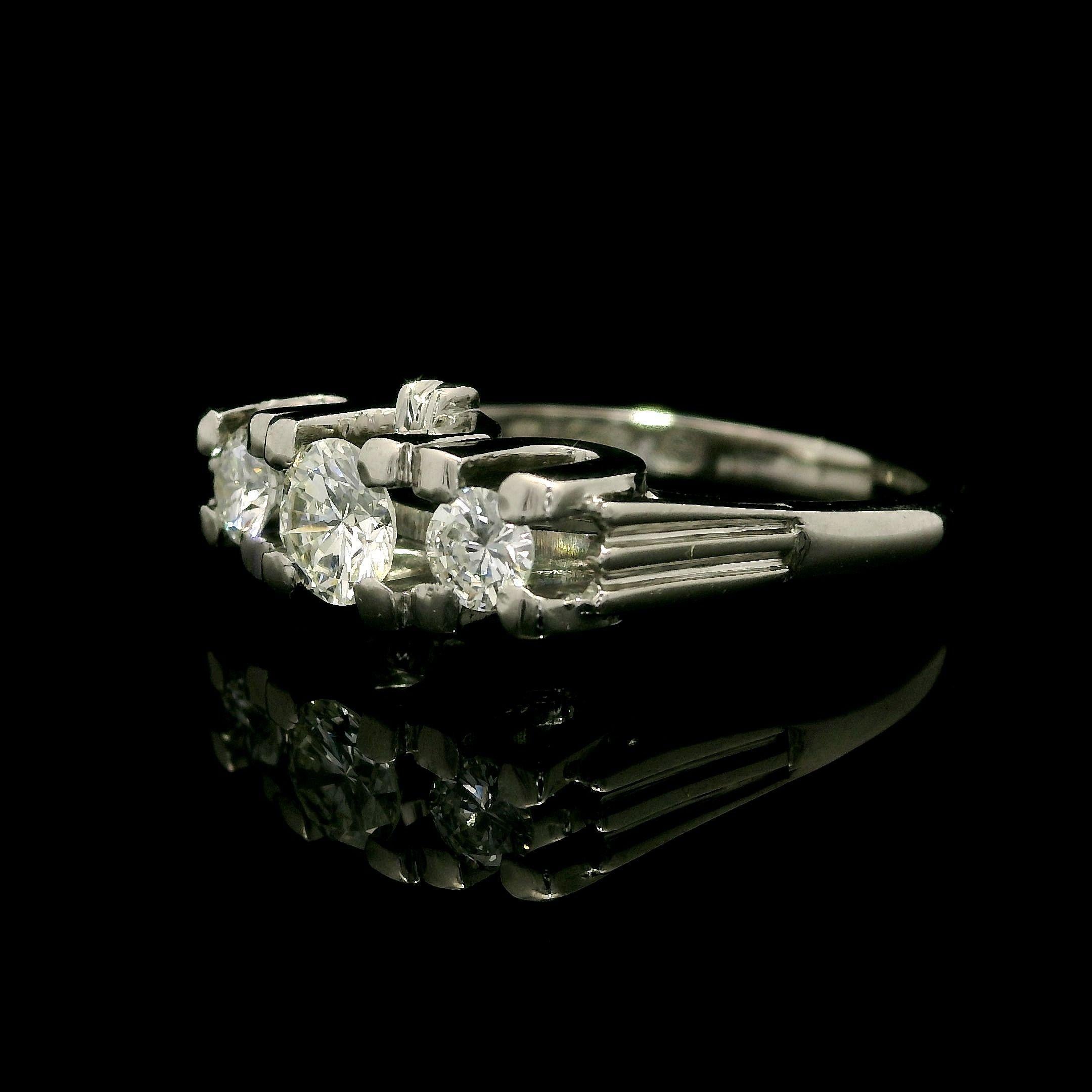Vintage English 18k White Gold 0.72ctw Round Cut Diamond 3 Stone Ring In Excellent Condition For Sale In Montclair, NJ