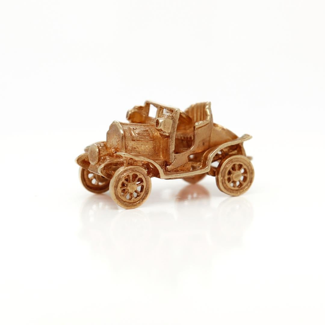 A fine vintage English gold charm.

In 9k yellow gold.

In the form of an old style automobile or jalopy.

Simply a wonderful English charm!

Date:
1969

Overall Condition:
It is in overall good, as-pictured, used estate condition with some fine &