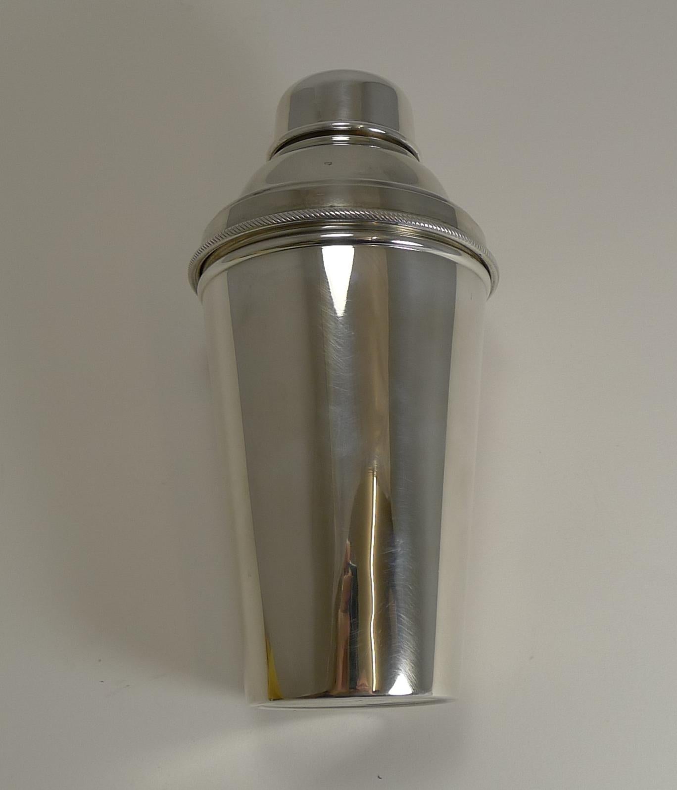 A wonderful one pint Cocktail Shaker in silverplate. Highly desirable, this one has an integral ice breaker which is revealed once the upper portion is removed.

The underside is signed by the well renowned silversmith, James Dixon and Sons and