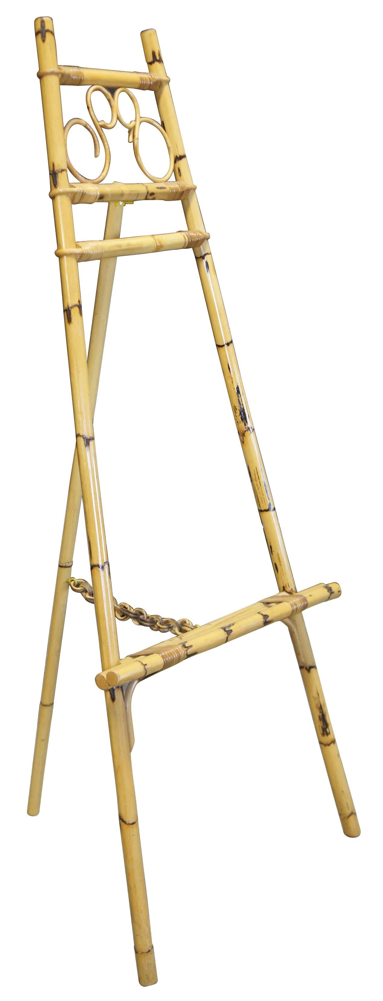 20th century bamboo easel or art stand. Features rattan accents and scrolled design towards top.
  
44