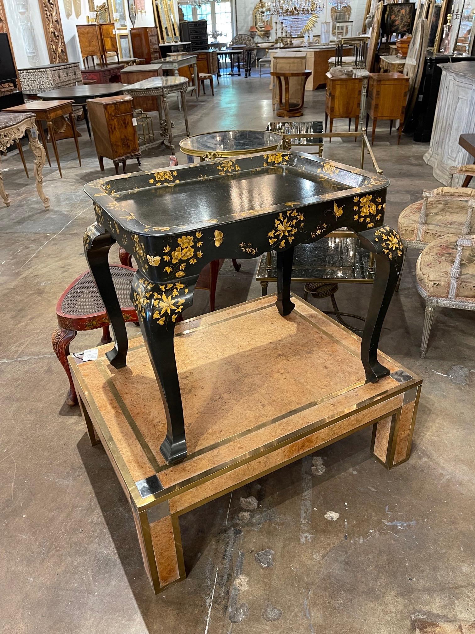 Decorative vintage English black lacquered and Chinoiserie inspired hand painted side table. Really pretty! A fabulous accent piece.