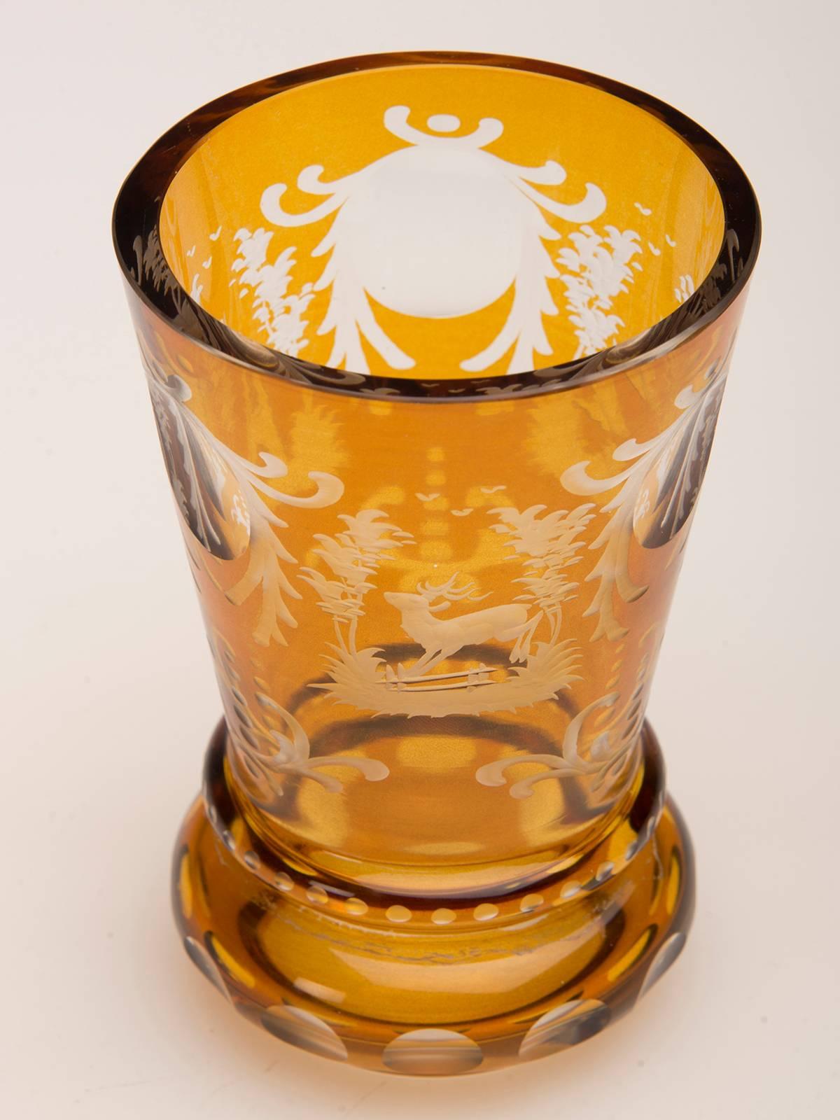 A beautiful vintage English Bohemian cut amber glass vase, circa 1950. The unique golden colour of this beautiful glass combined with the unusual shape combine to create a handsome vessel that is striking on its own for display or used as a