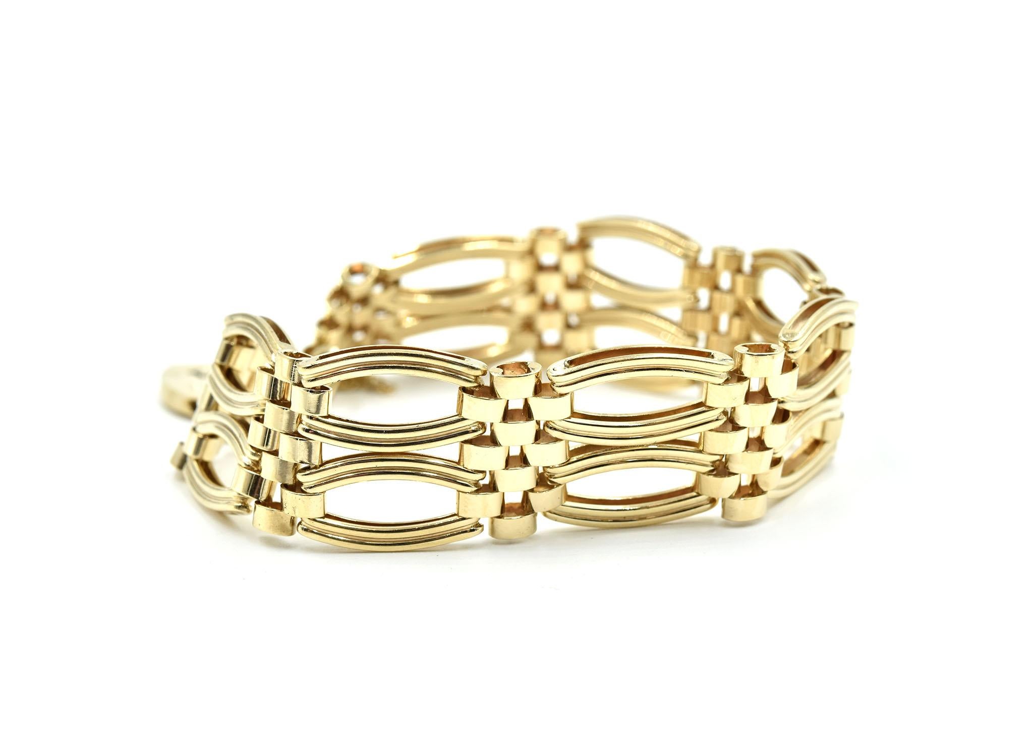 This is a vintage English style bracelet made in 9k yellow gold with a locking heart in the center. The heart has a lever that if pushed releases the heart. The bracelet has a security chain. The bracelet will fit up to a 7.5” inch wrist and the