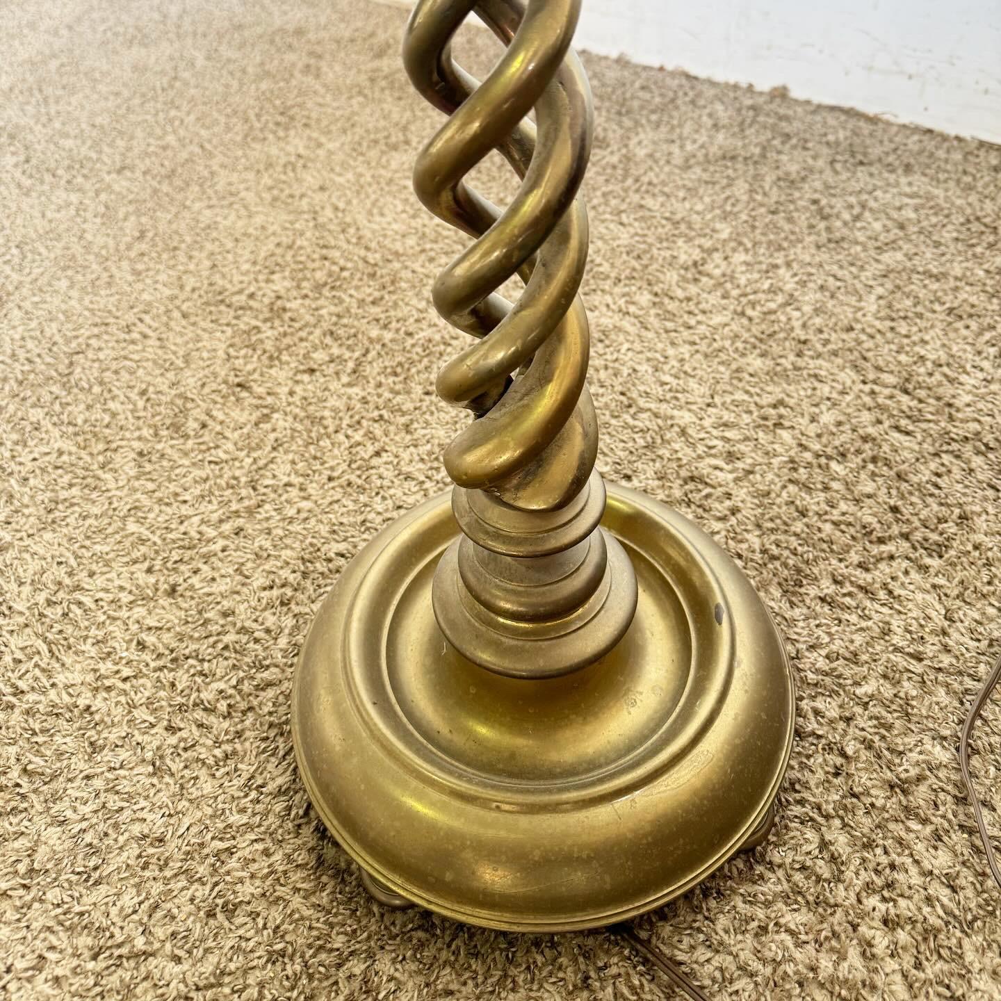 The Vintage English Brass Barley Twist Candle Stick Floor Lamp brings vintage charm and elegance to any setting. Featuring a classic barley twist design in English brass, it adds a warm, golden ambiance. Ideal for reading or as a decorative accent,