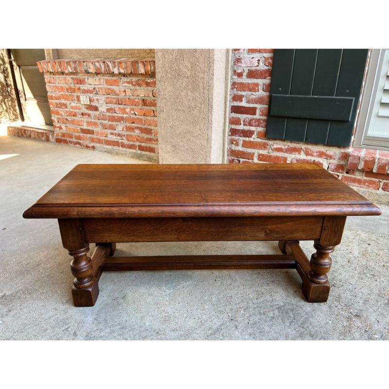Vintage English Carved Oak Bench Stool Low Table Ottoman Jacobean Style.

Direct from England, this charming vintage bench, versatile in size and style, perfect for a million uses! Features include a heavy oak, beveled edge top (about 3.5 ft.
