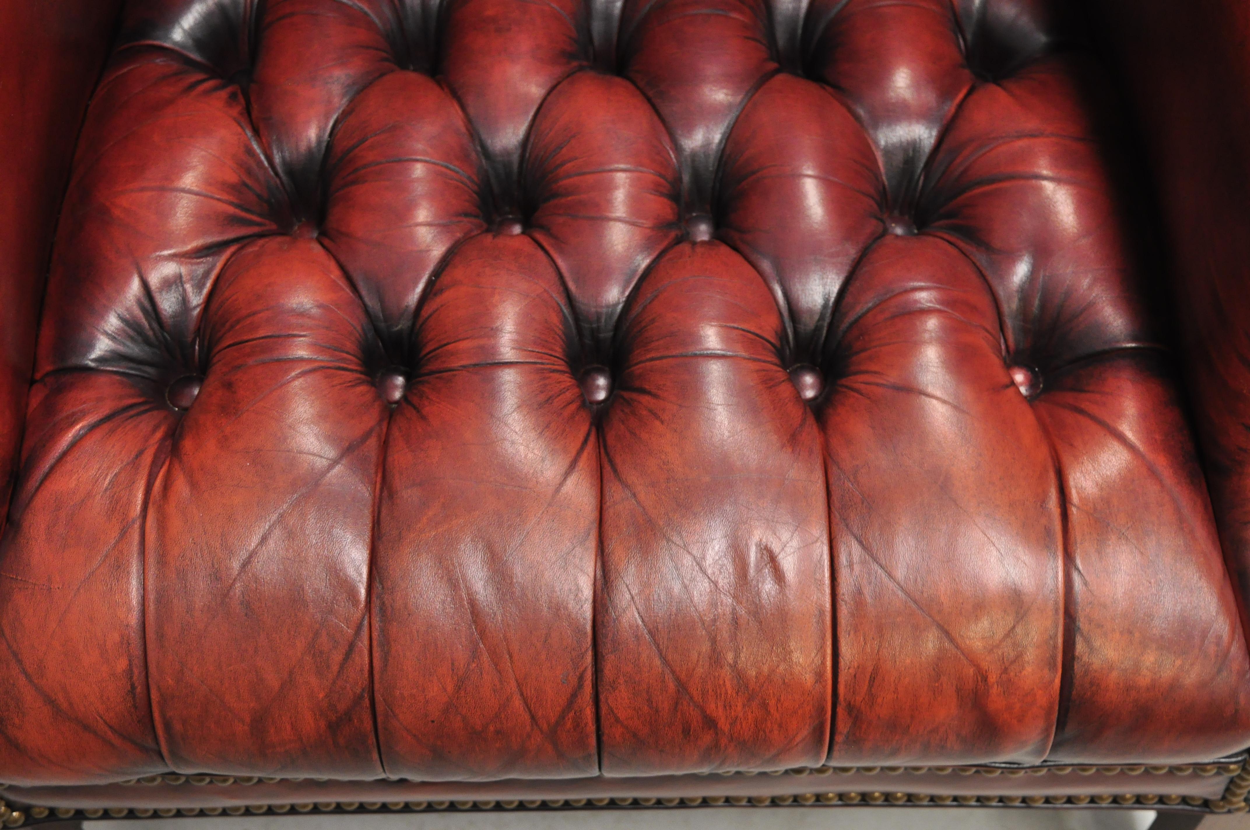 20th Century Vintage English Chesterfield Style Button Tufted Burgundy Leather Wingback Chair