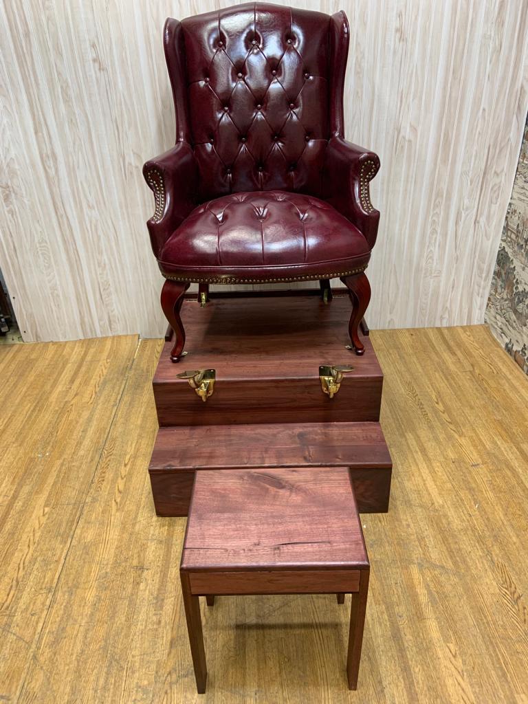 Vintage English Chesterfield Style Tufted Leather Chair on a Shoe Shine Stand

Classic vintage custom English Chesterfield style burgundy tufted leather chair. This beautiful chair comes with a solid mahogany finished step up base with single drawer