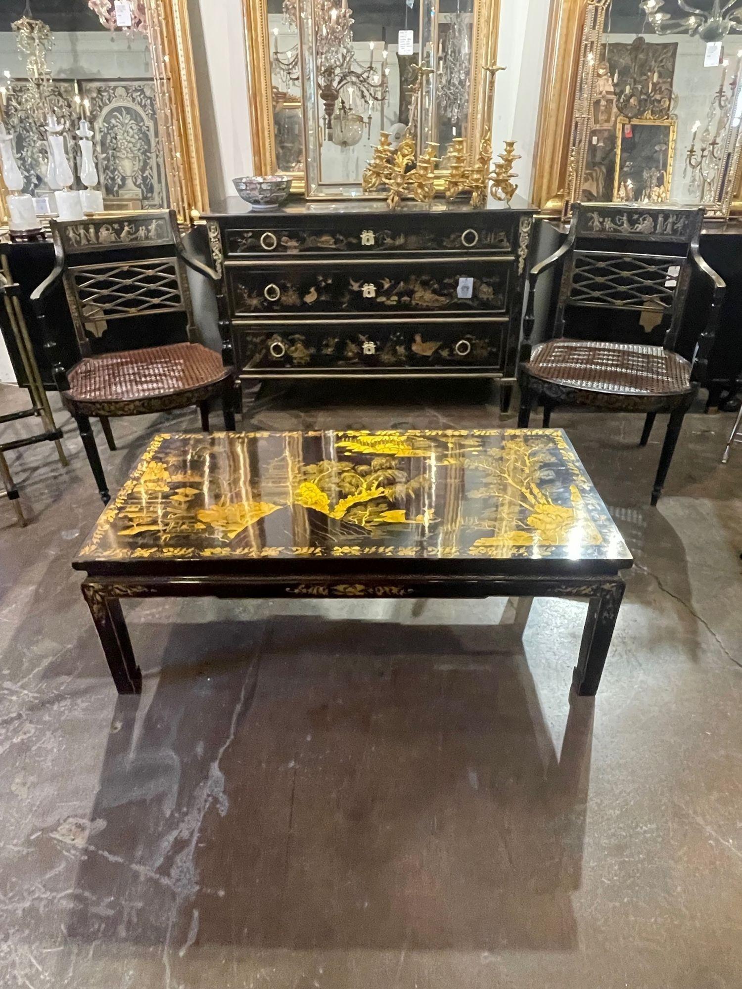 Exceptional vintage English Chinoiserie decorated coffee table. Beautifully hand painted Asian designs on a deep mahogany colored lacquered base. Very fine quality! A true work of art!