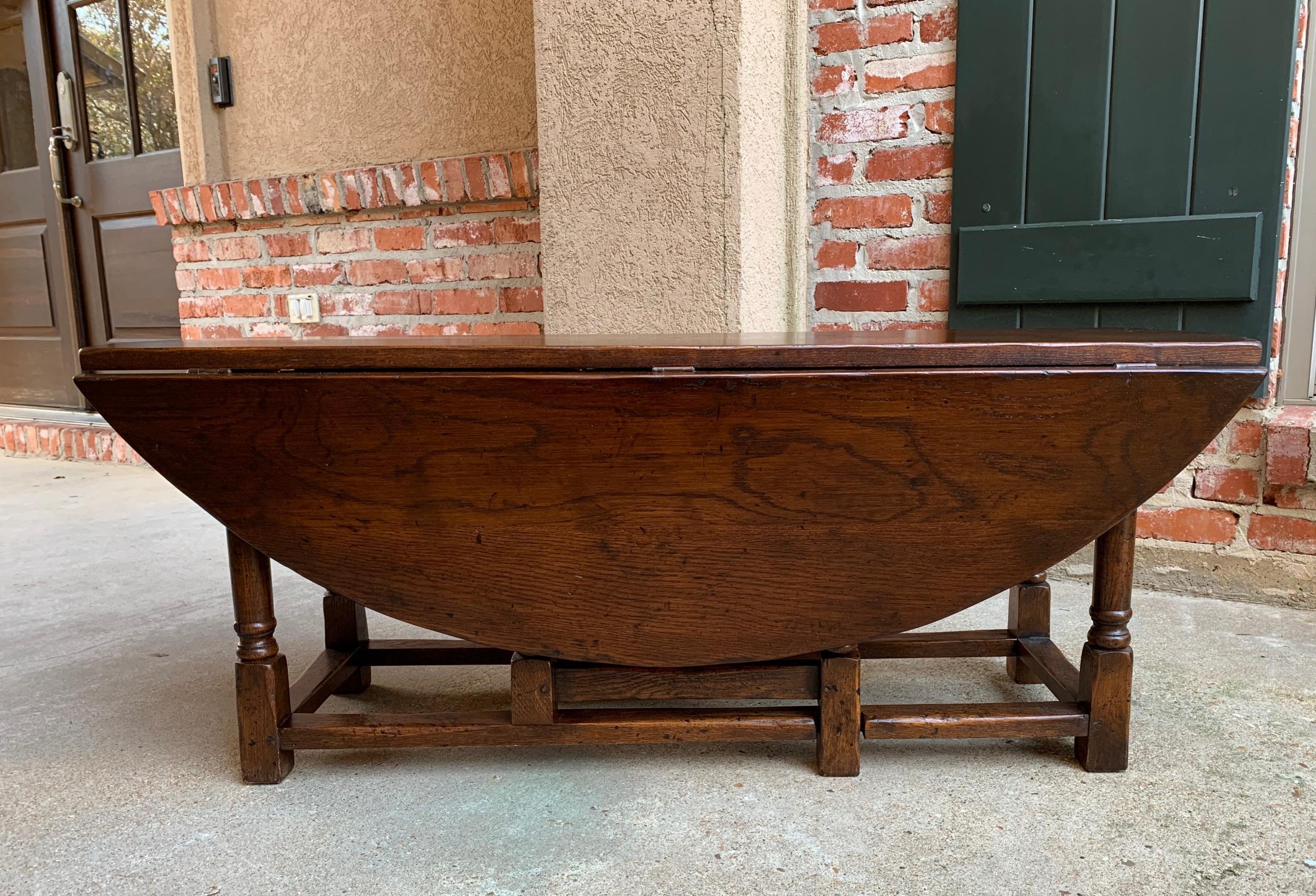 Vintage English coffee table drop leaf jacobean gate leg wake table design.

~Direct from England~
~Lovely silhouette on this vintage English coffee table~
~Long and slender, in a traditional “wake table” design, with two drop leaves that can