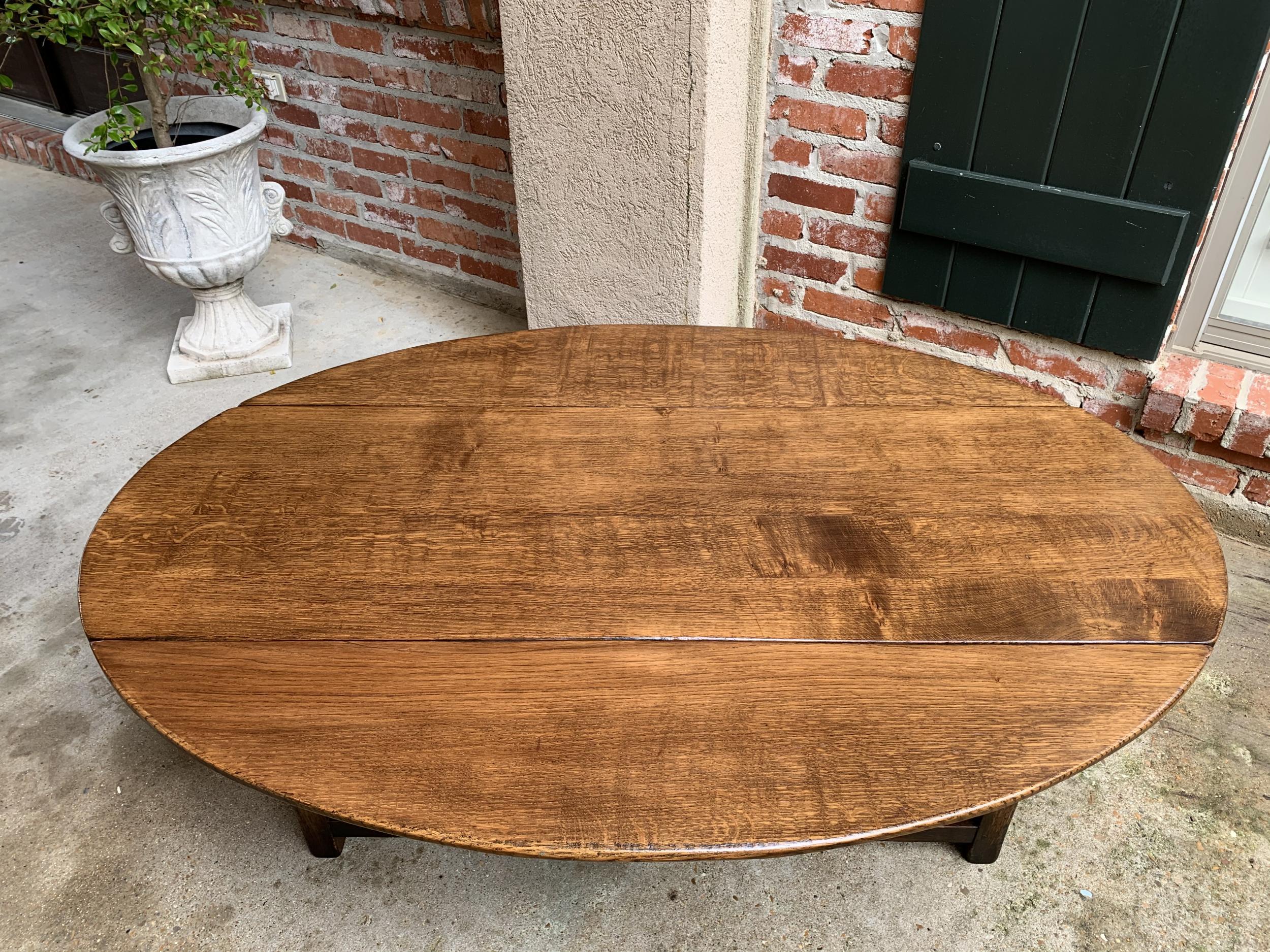 20th Century Vintage English Coffee Table Slender Drop Leaf Wake Table Oval Mid Century