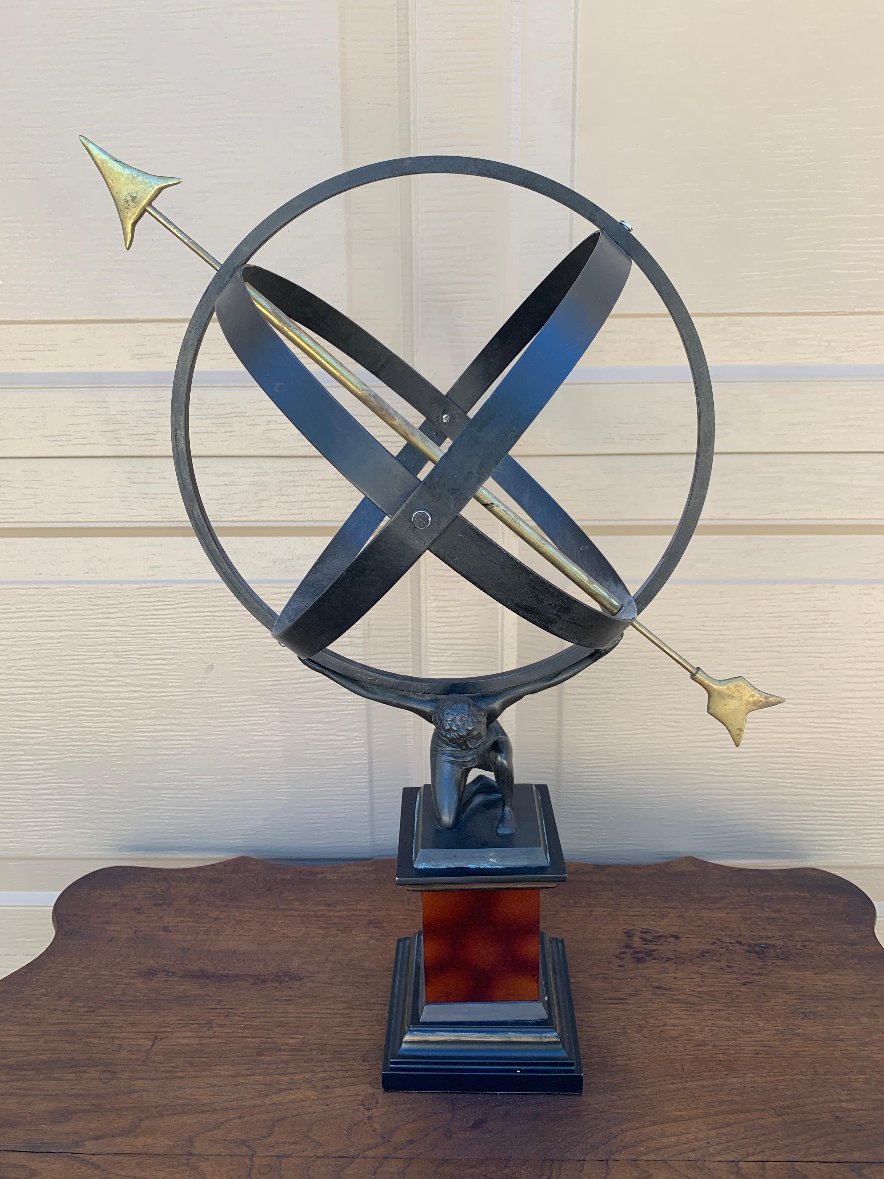 A stunning vintage iron garden armillary sundial being held up by mythological Atlas

USA, Late 20th Century

Measures: 15