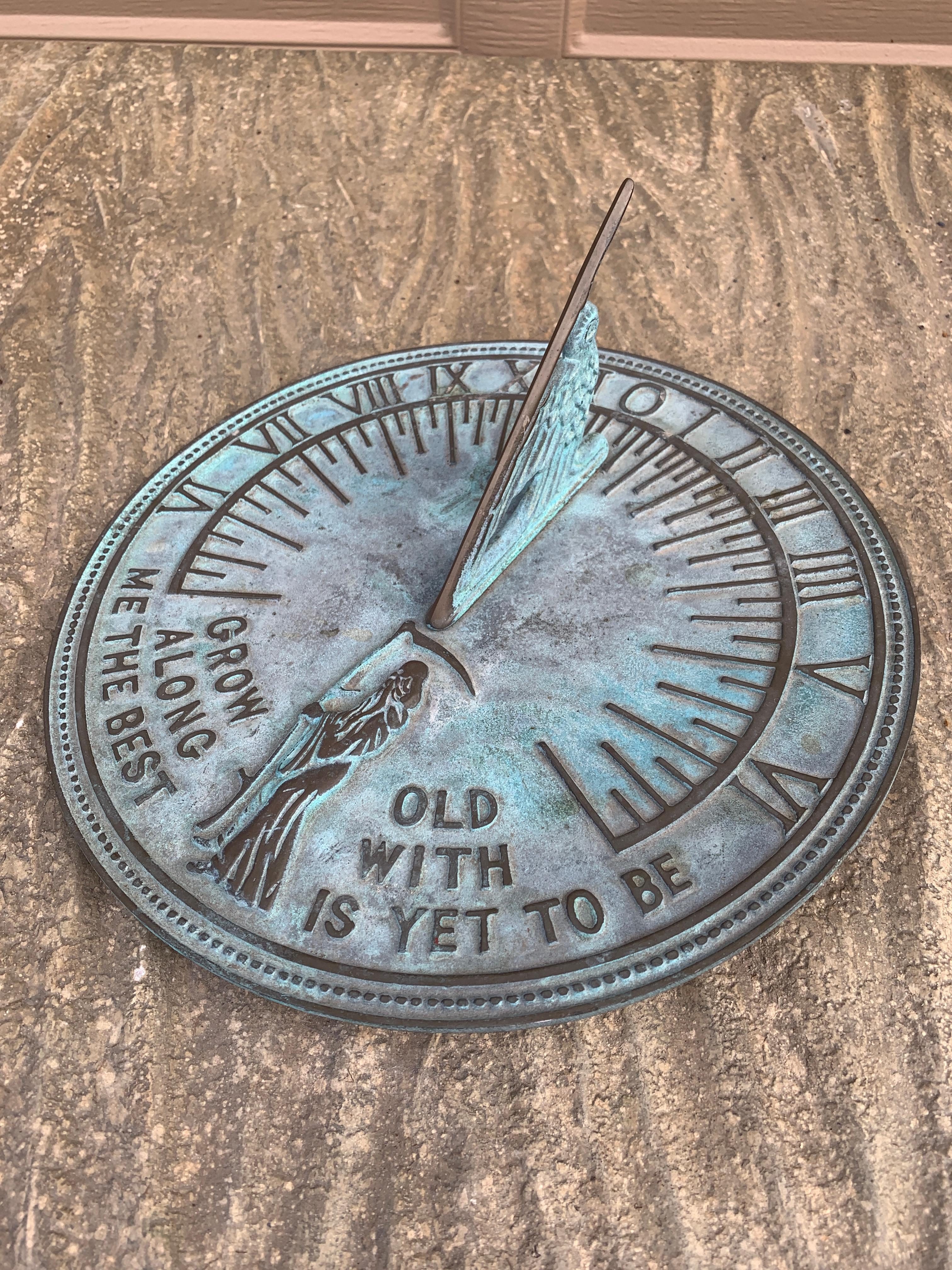 A stunning vintage iron garden sundial reading 