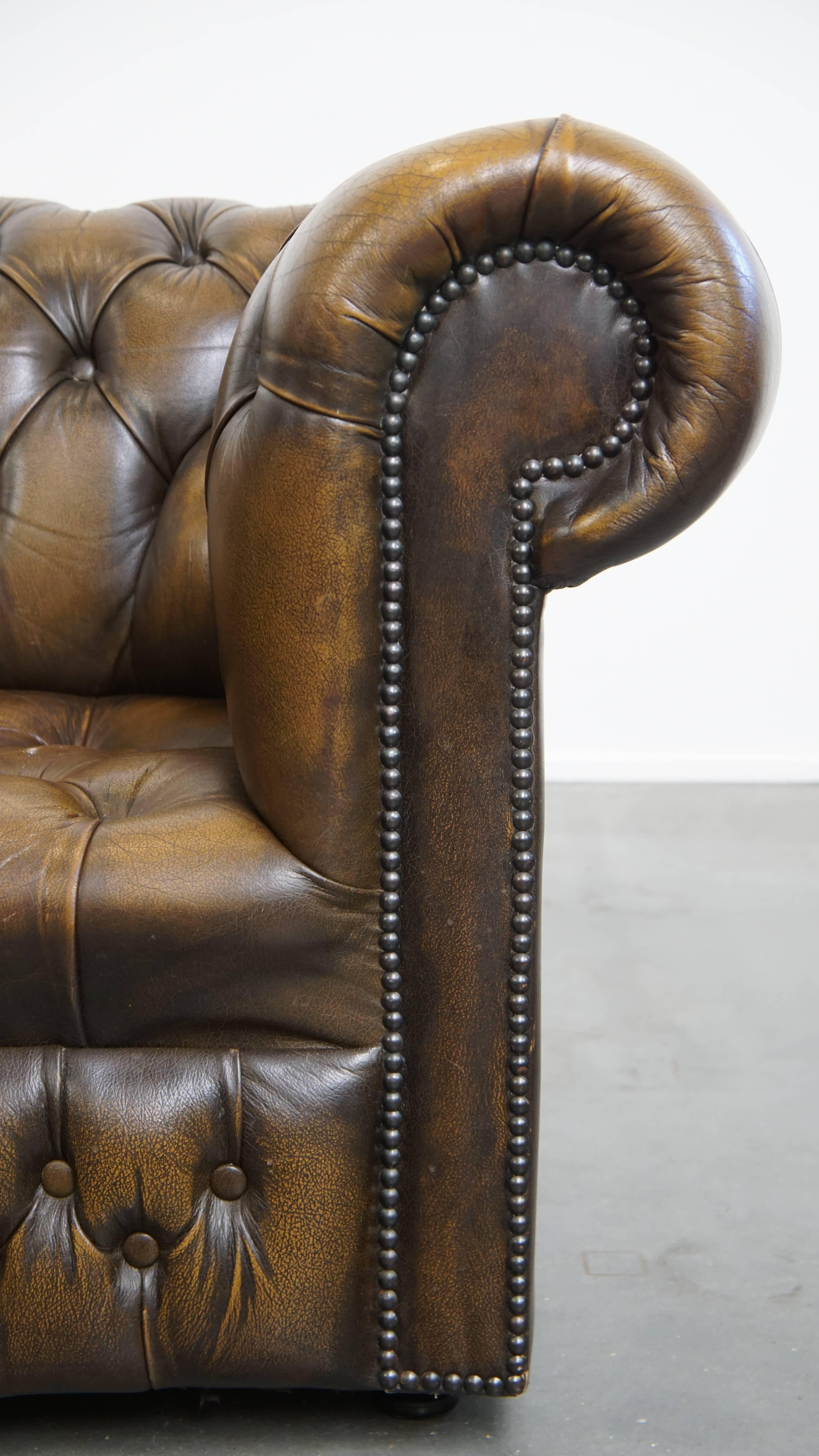 Vintage English Cowhide Leather Chesterfield Button Seat Armchair For Sale 4