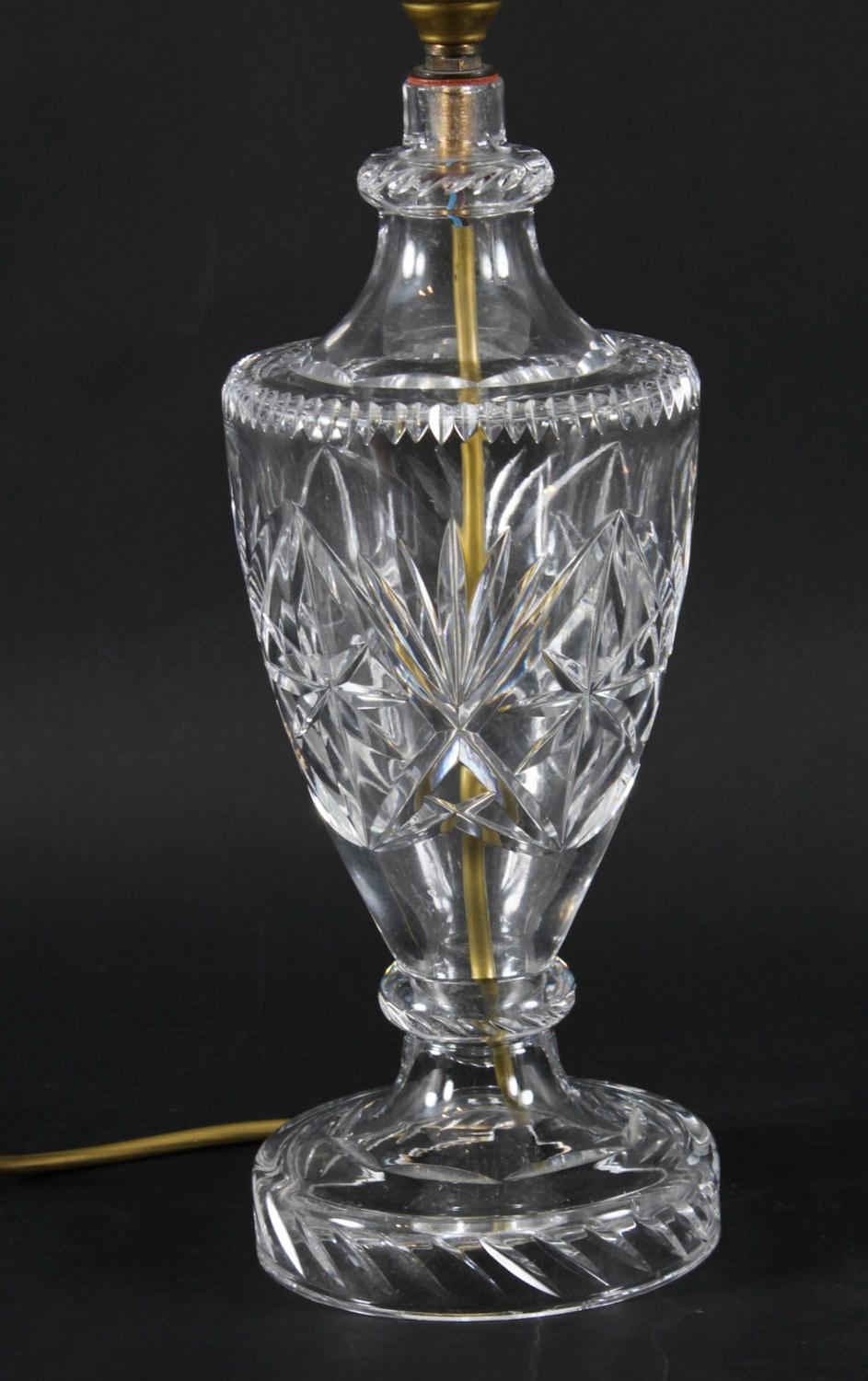 This is an elegant vintage English cut glass table lamp, late 20th century in date.

This elegant lamp has a sophisticated cut glass body. The lamp is  in a classical psykter urn form, decorated with cut star design.

The unique quality and design