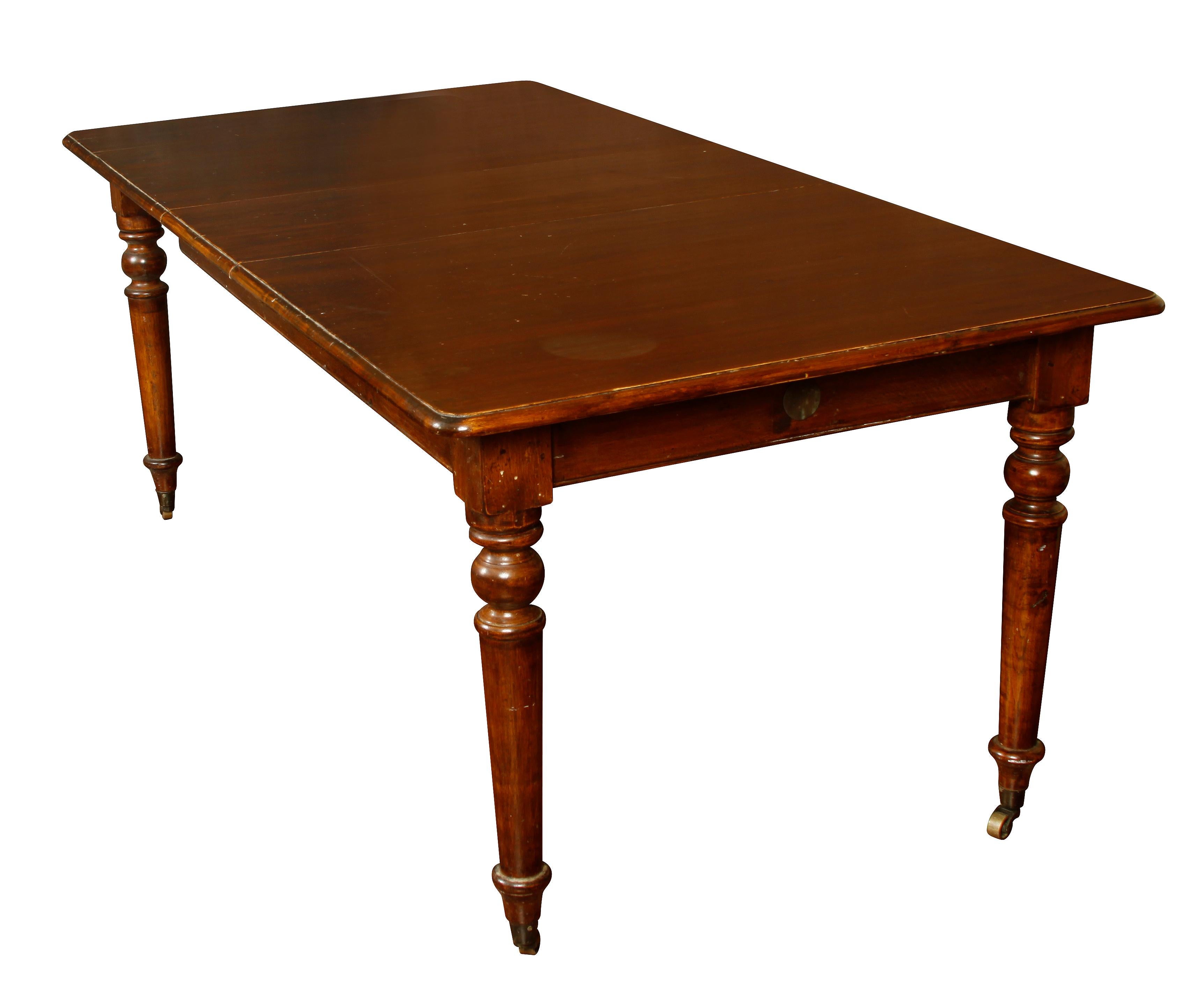 Vintage English dining table with one leaf, on casters with ringed balaster legs. Fully extends to 80
