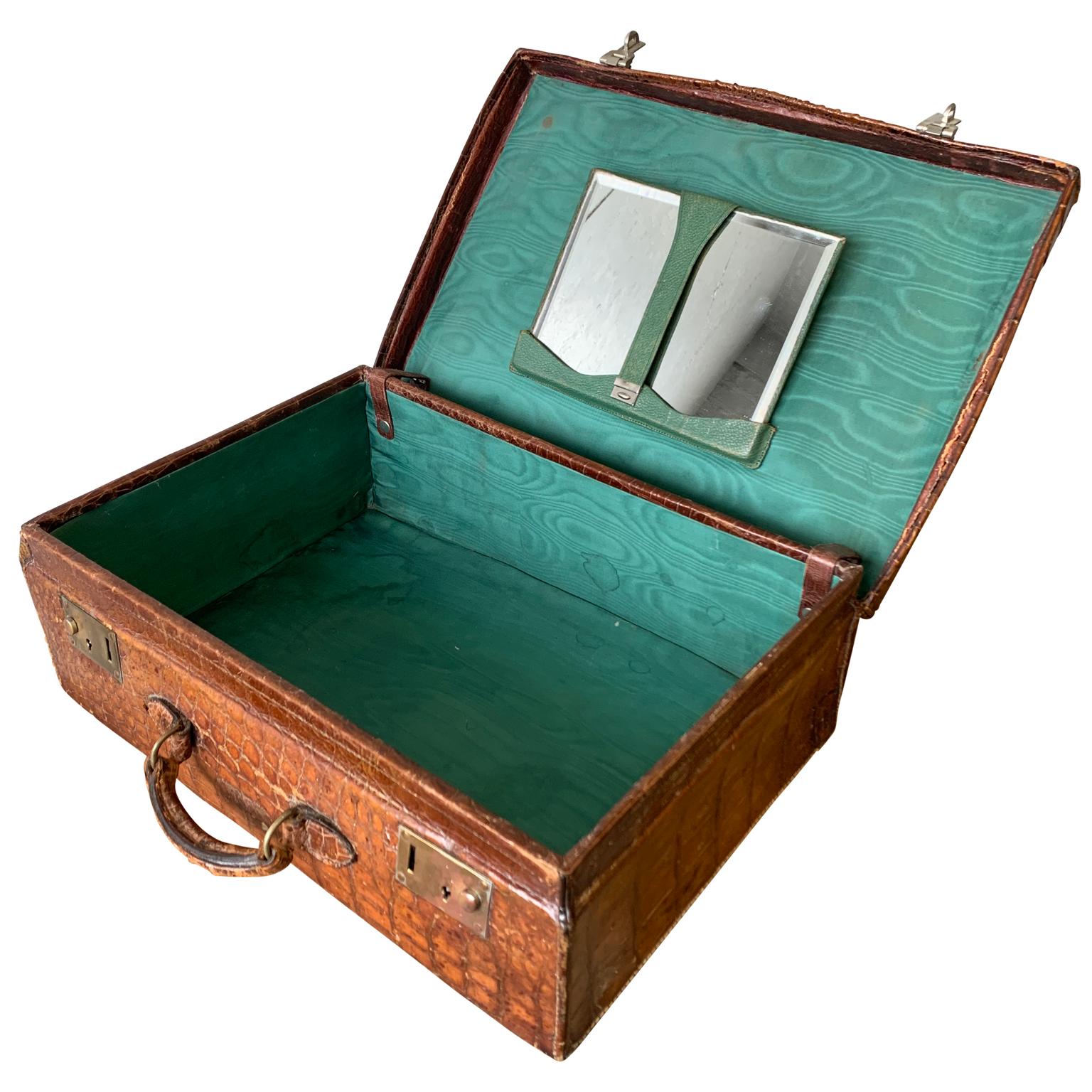 Vintage English Edwardian crocodile suitcase with bevelled vanity mirror.
