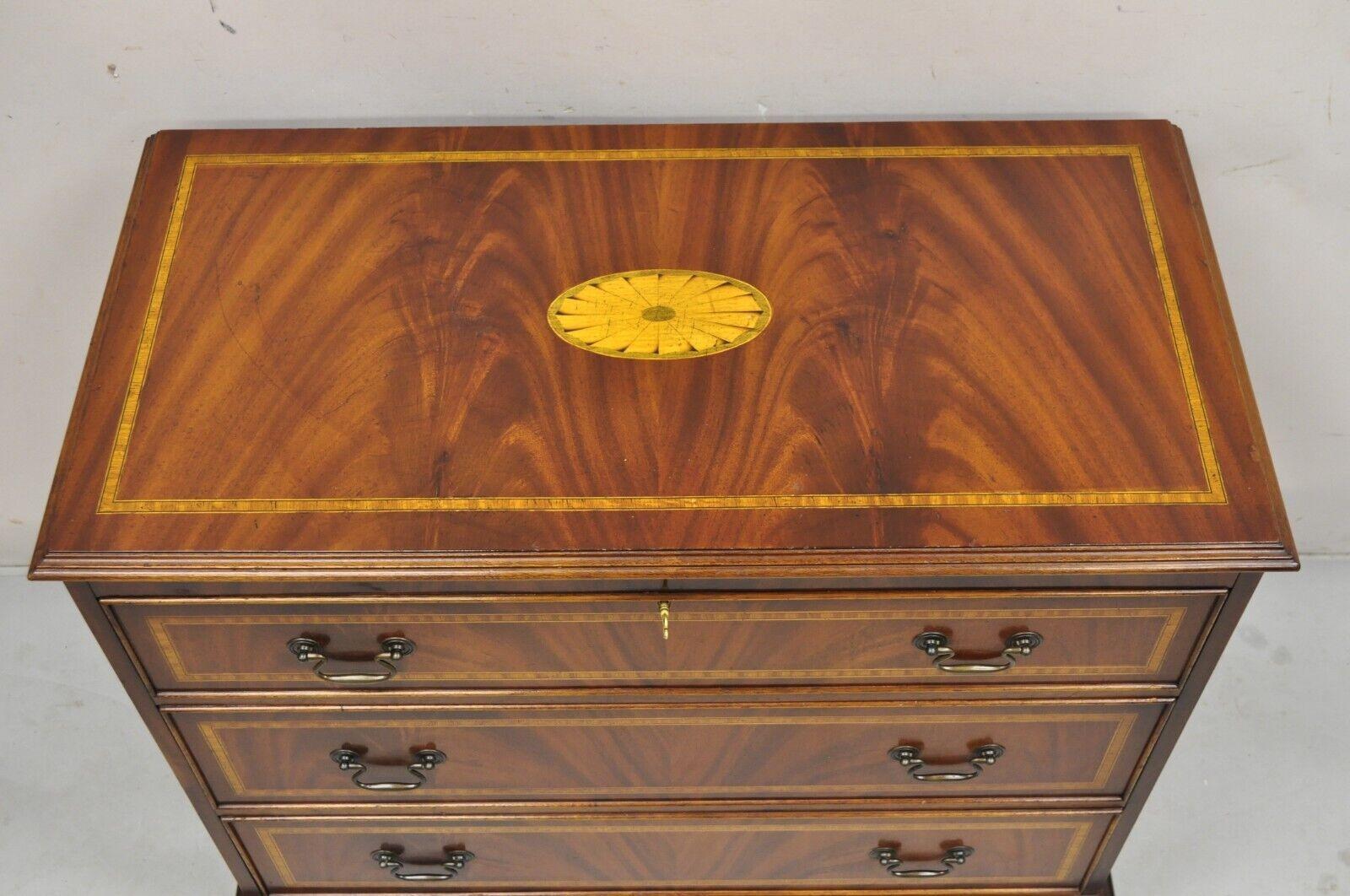 Vintage English Edwardian Style Mahogany Pinwheel Inlay 3 Drawer Dresser Chest. Item features 3 dovetailed drawers, banded inlay top and drawer fronts, crotch mahogany wood grain, pinwheel central inlay, very nice vintage chest. Circa Mid to Late