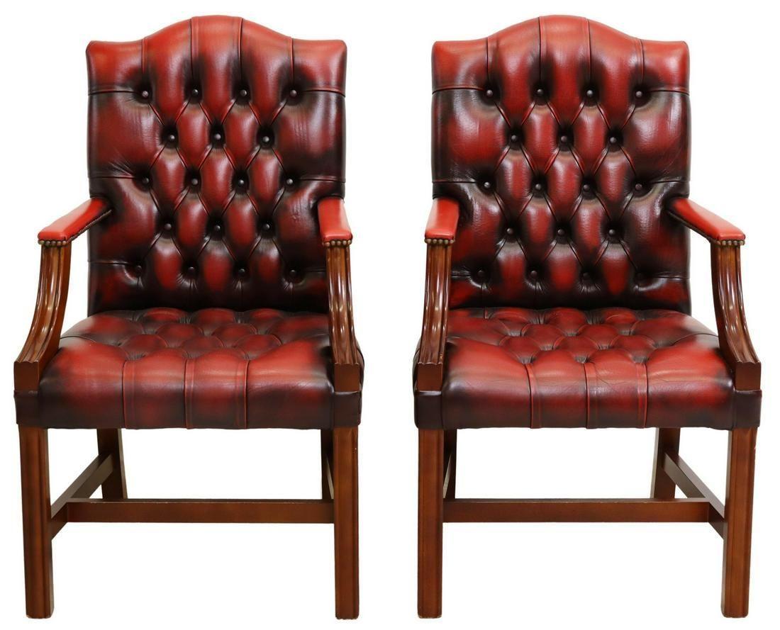 A pair of English Gainsborough style leather armchairs, late 20th c. The armchairs feature button-tufted back and seat in distressed red leather upholstery, nailhead trim, rising on squared supports joined by H stretcher.

Dimensions
approx 40