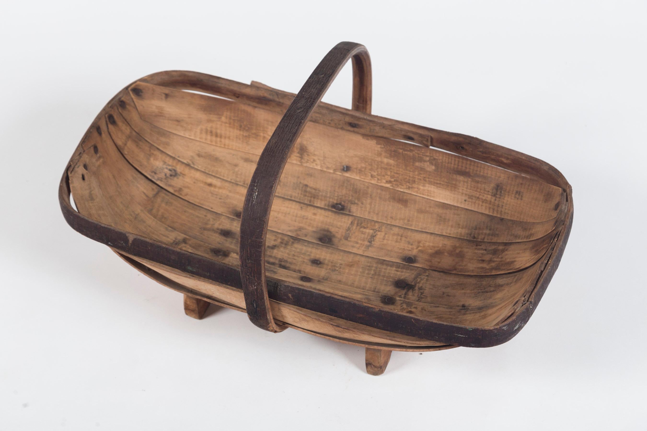 Vintage English garden trug (basket), circa 1930. Traditional Sussex oblong shape, bentwood construction. Trugs were designed to gather flowers and herbs from the garden. Lovely aged wood surface.