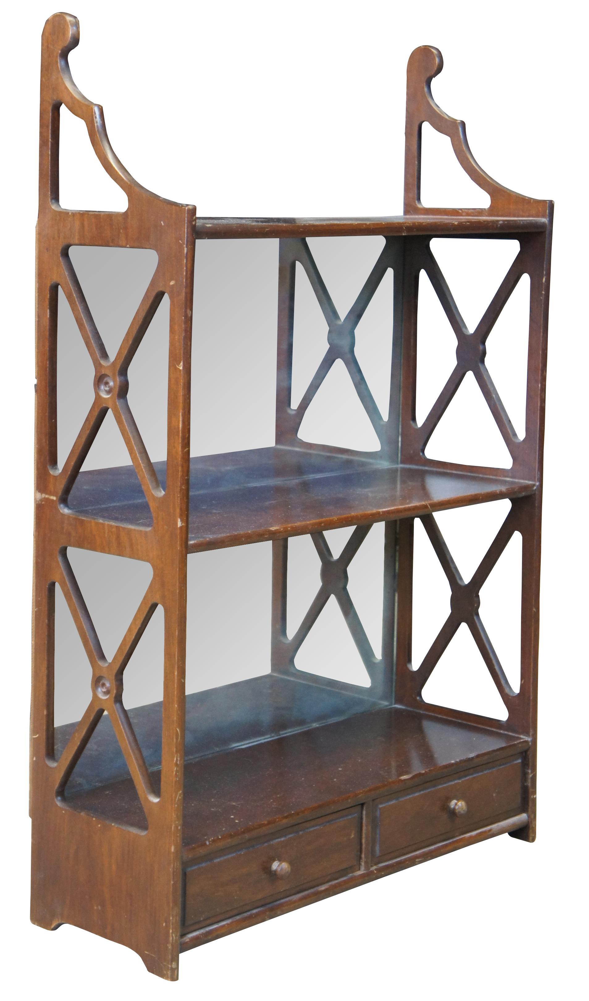 Vintage Georgian style wall shelf, circa 1960s. Features open x paneling along the sides and two drawers for storage.