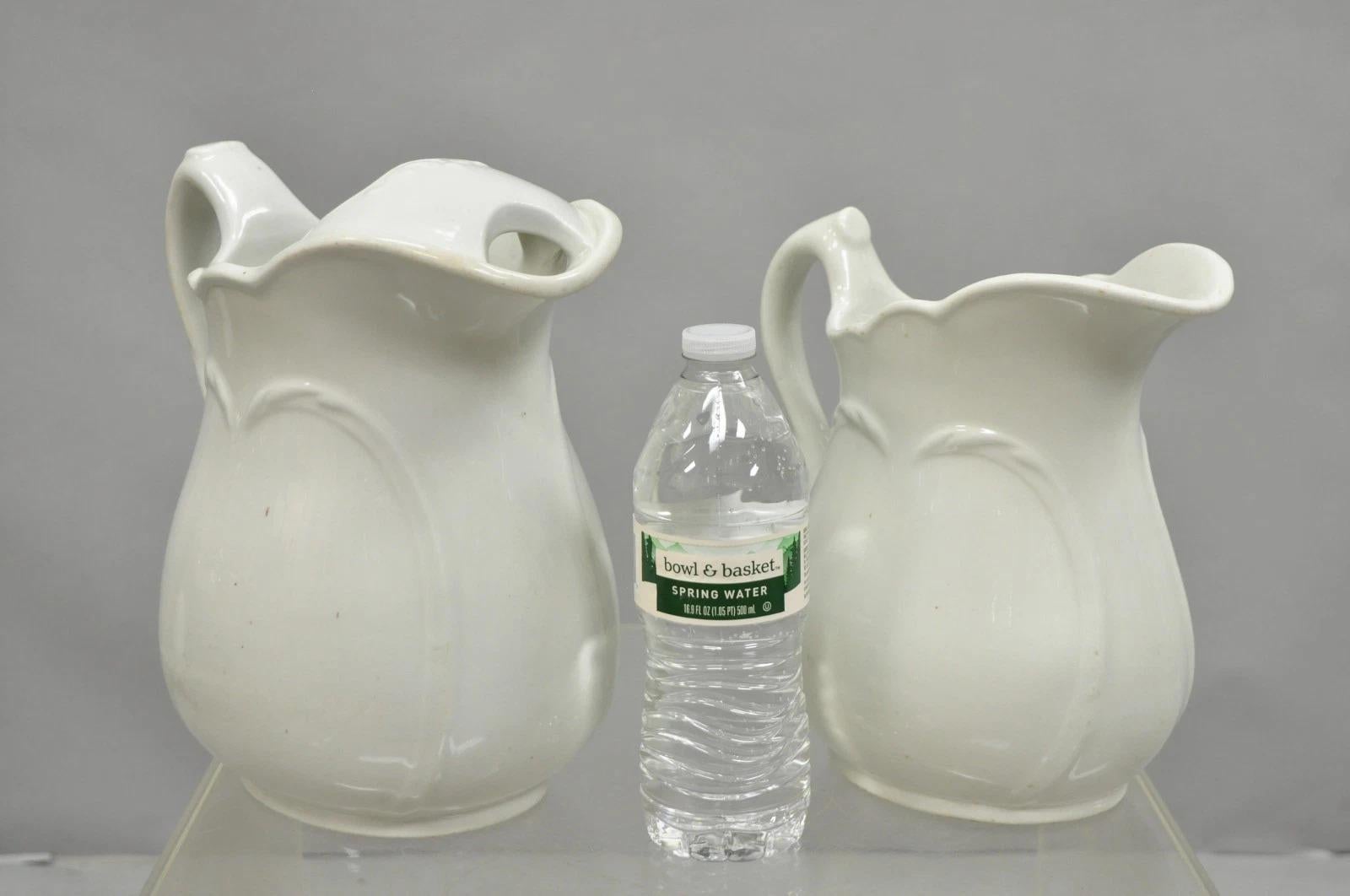 Vintage English Ironstone White Farmhouse Milk Water Pitchers - Set of 2. Circa Early 20th Century. Measurements: Small: 9