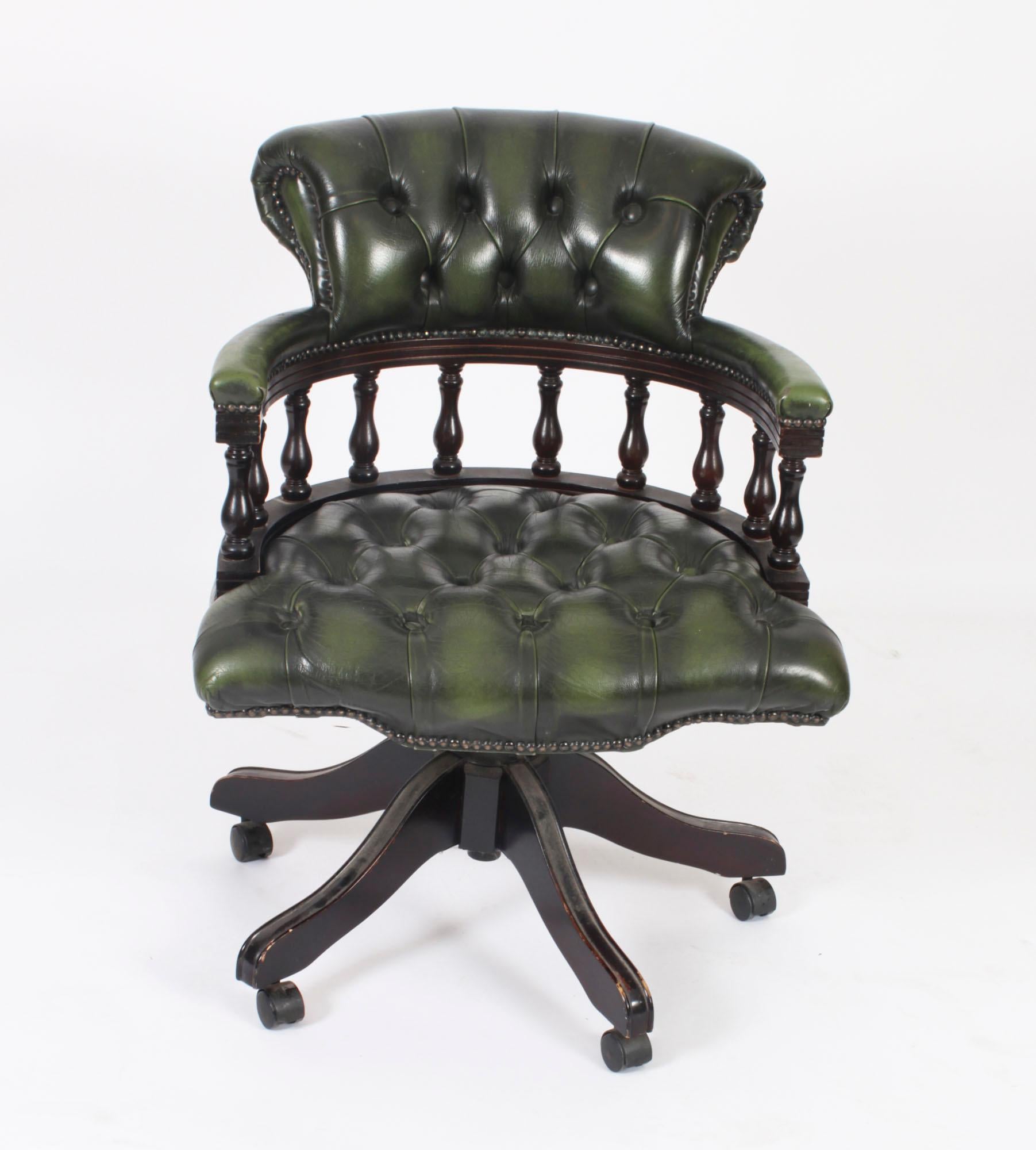 This is a vintage leather 'Captains chair' in a beautiful sage green colour, hand-made in England with materials of the finest quality and dating from the late 20th Century.

Height is adjustable and it has a swivel and tilt option.

Handmade