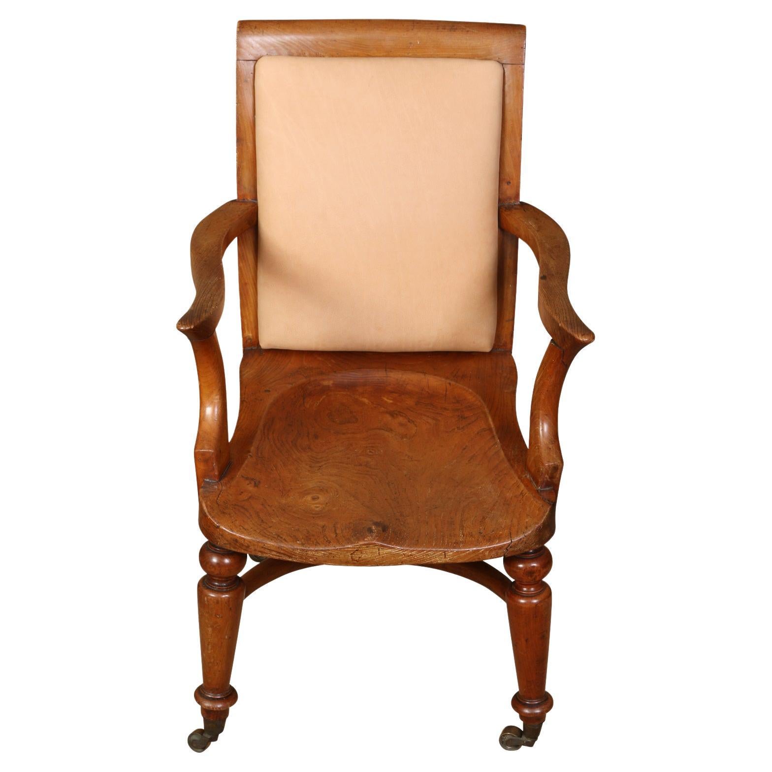 Vintage English Library Chair with Upholstered Leather Back and Casters For Sale