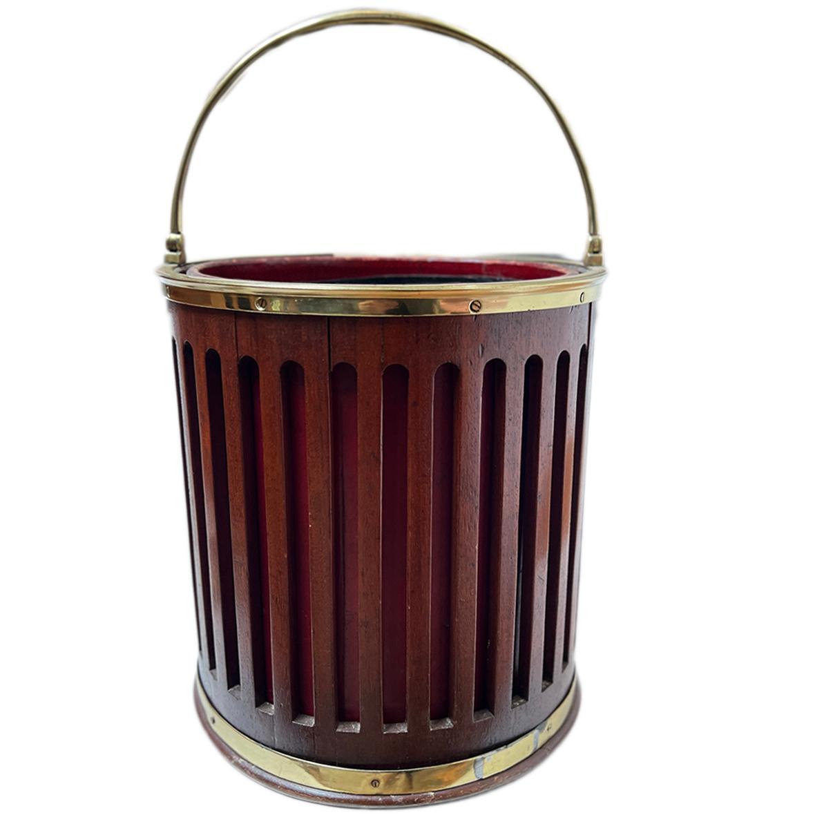 A circa 1950's English mahogany and leather bucket.

Measurements:
Height1: 13