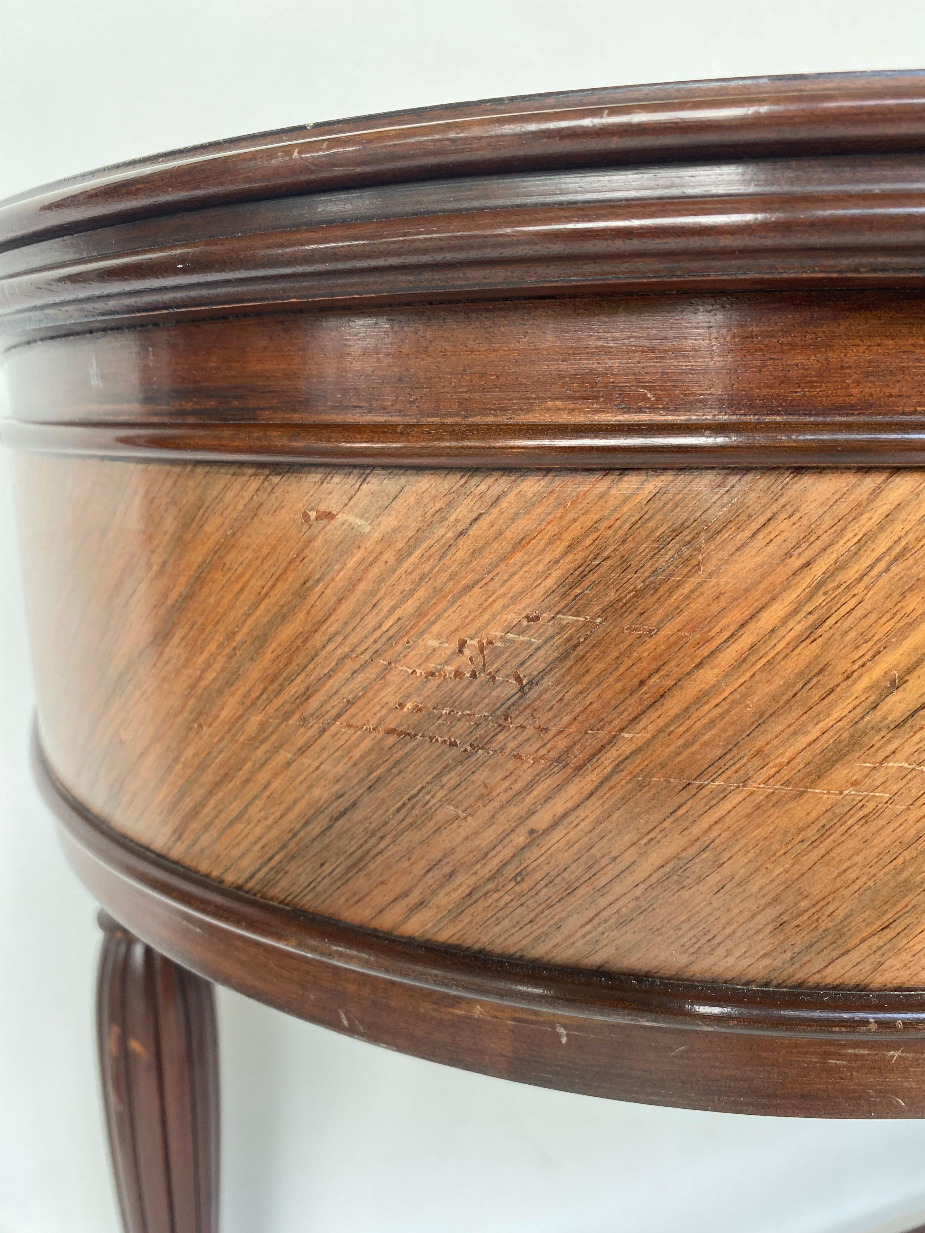 Vintage English Marquetry Inlay Console with Book-matched Veneer

Offered for sale is a vintage reproduction of an English console table with marquetry inlay and book-matched veneer top with banding.  The console is raised on four fluted tapering