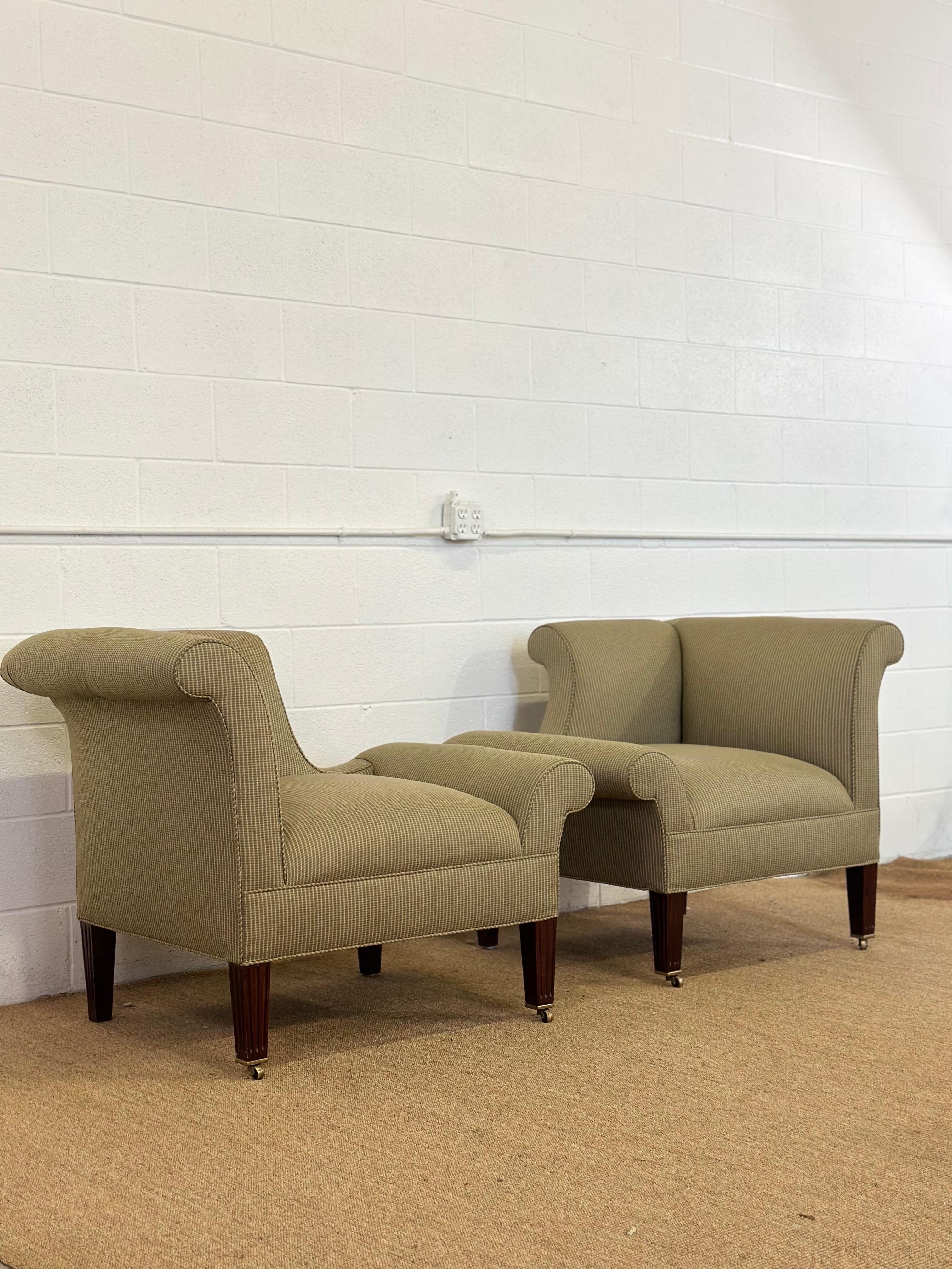 We are very pleased to offer a pair of lounge chairs attributed to British architect Sir Edwin Lutyens, known for his masterful blending of classical and modern forms.  These Napoleon chairs feature gracefully rolled arms, low deep seats, and