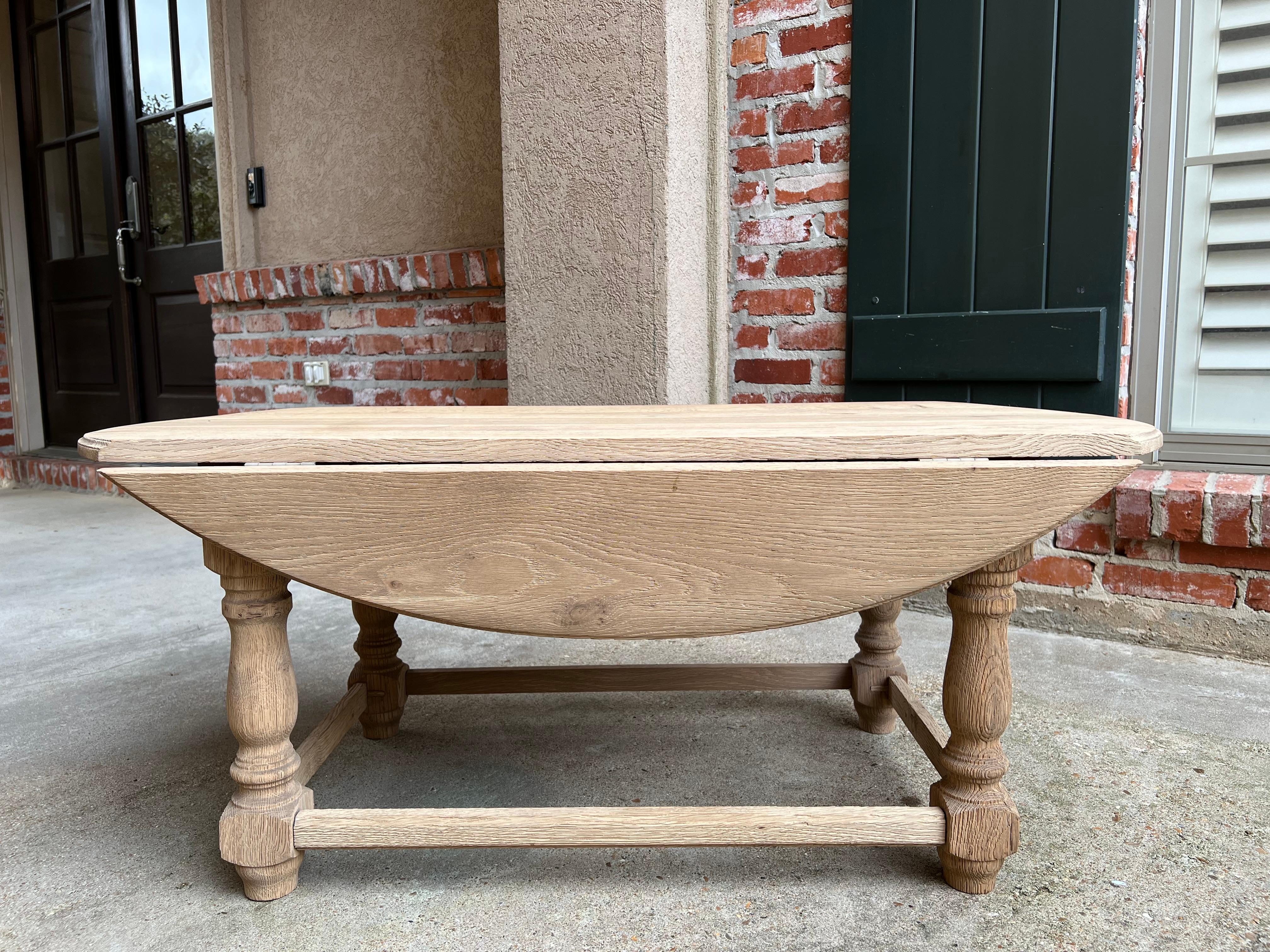 Vintage English Oak Bleached coffee table Slender drop leaf Wake table style oval.

Direct from England, this vintage English coffee table with a lovely silhouette and completely bleached finish! Long and slender, in a traditional “wake table”