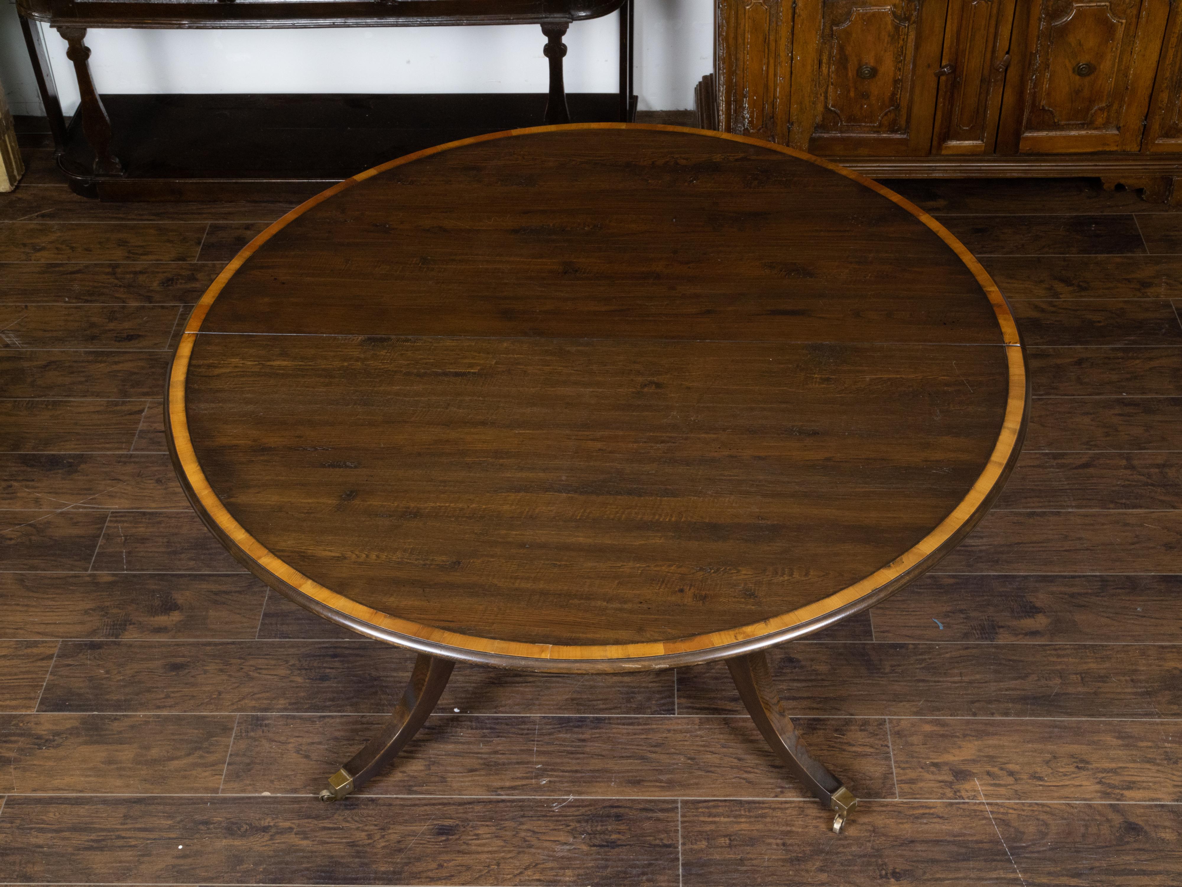 Vintage English Oak Extension Table with Two Leaves and Four Legs on Casters For Sale 4