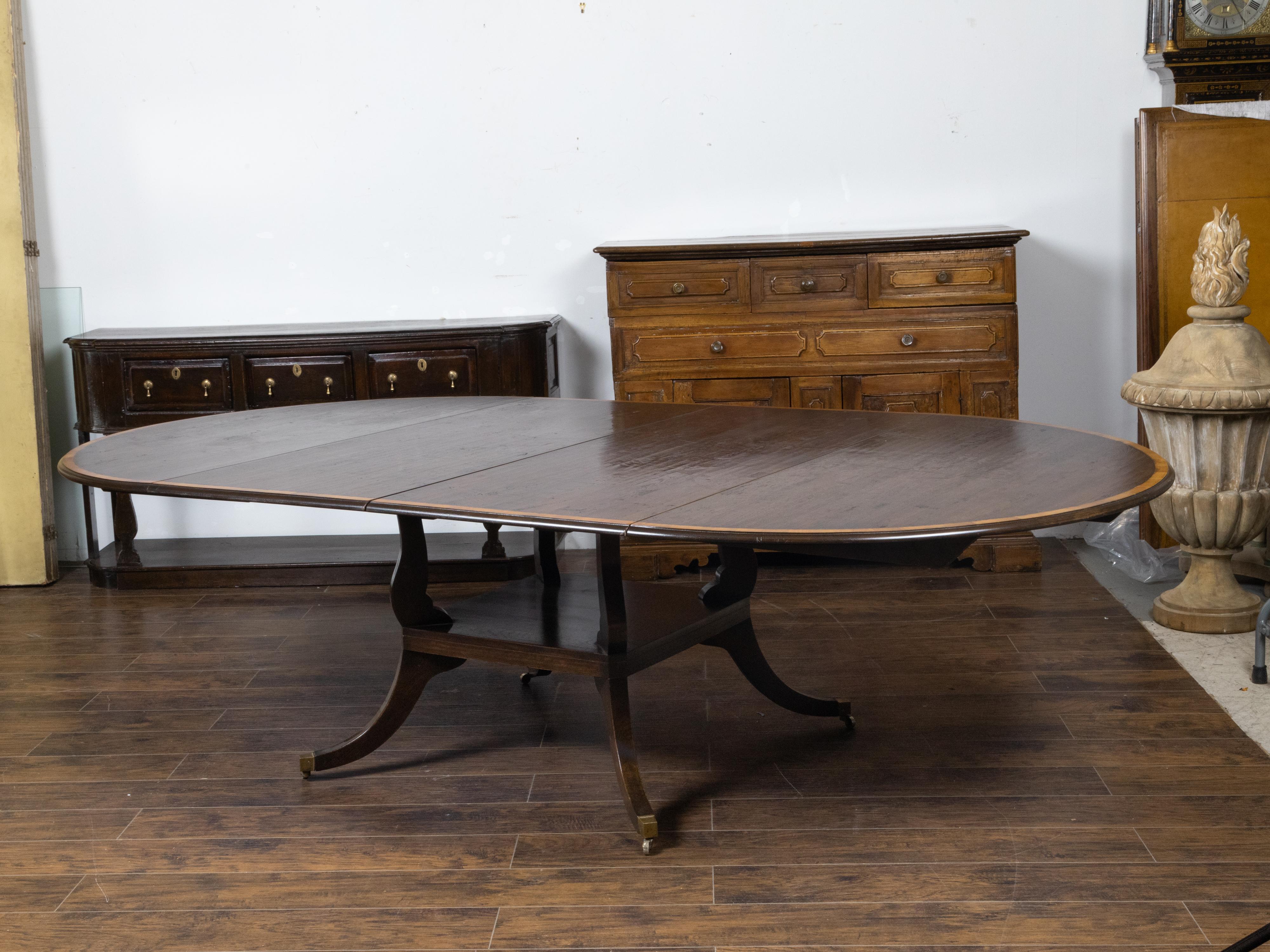 Vintage English Oak Extension Table with Two Leaves and Four Legs on Casters For Sale 5