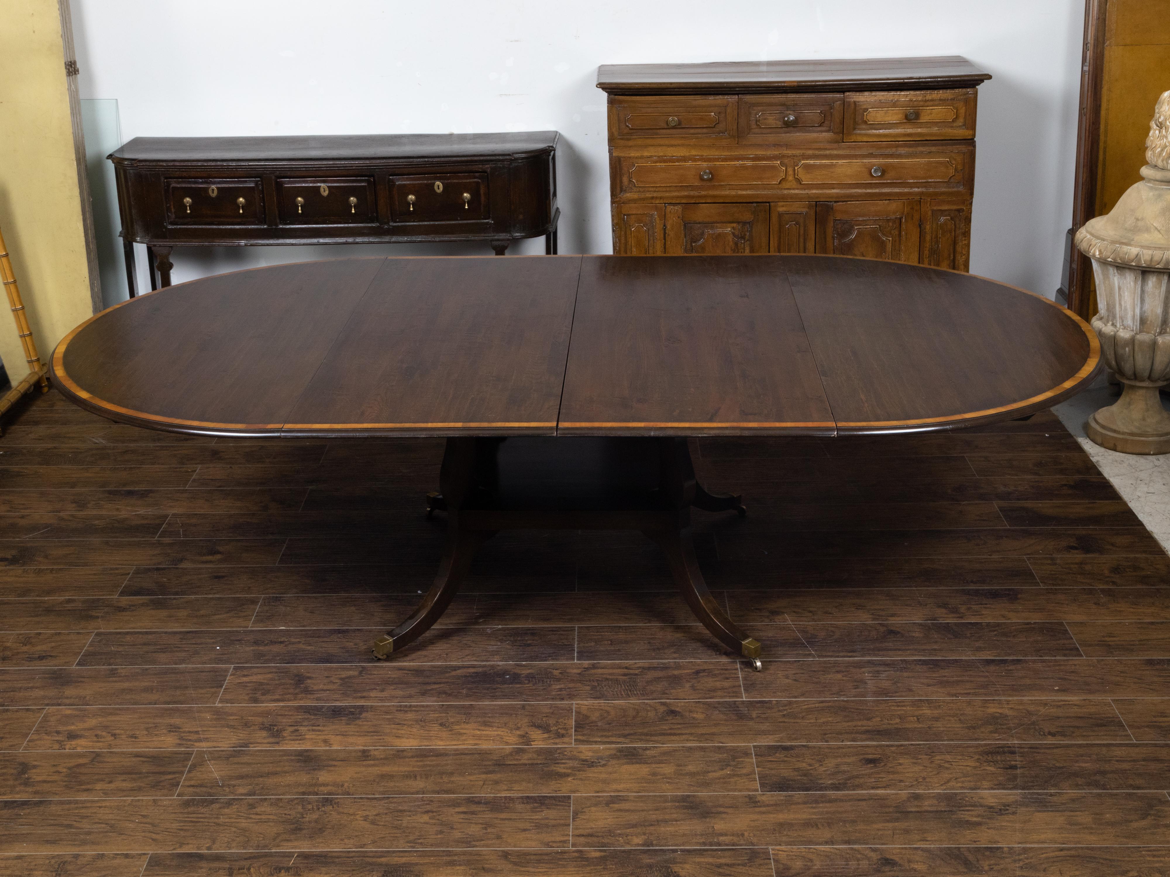Vintage English Oak Extension Table with Two Leaves and Four Legs on Casters In Good Condition For Sale In Atlanta, GA