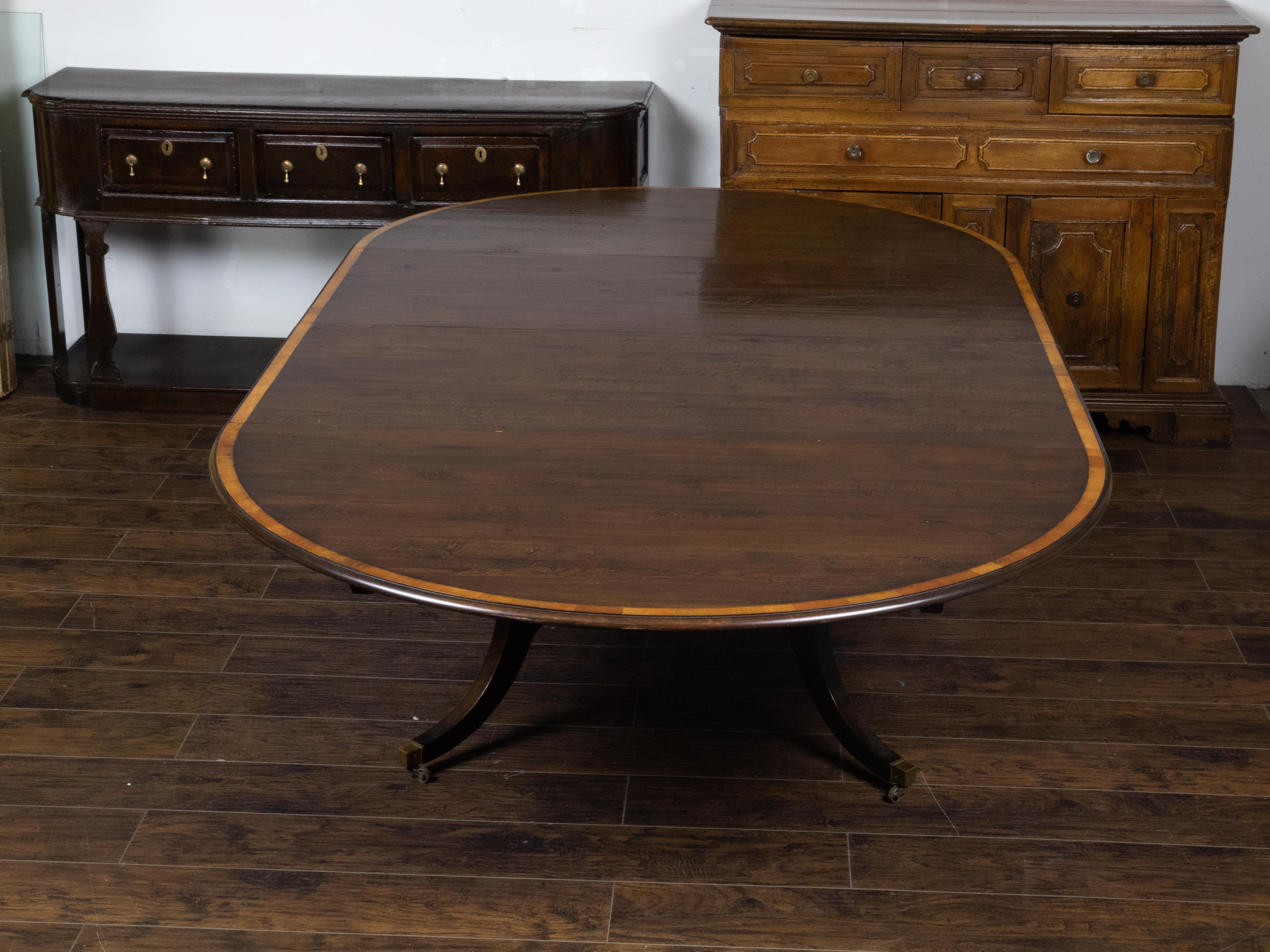 20th Century Vintage English Oak Extension Table with Two Leaves and Four Legs on Casters For Sale