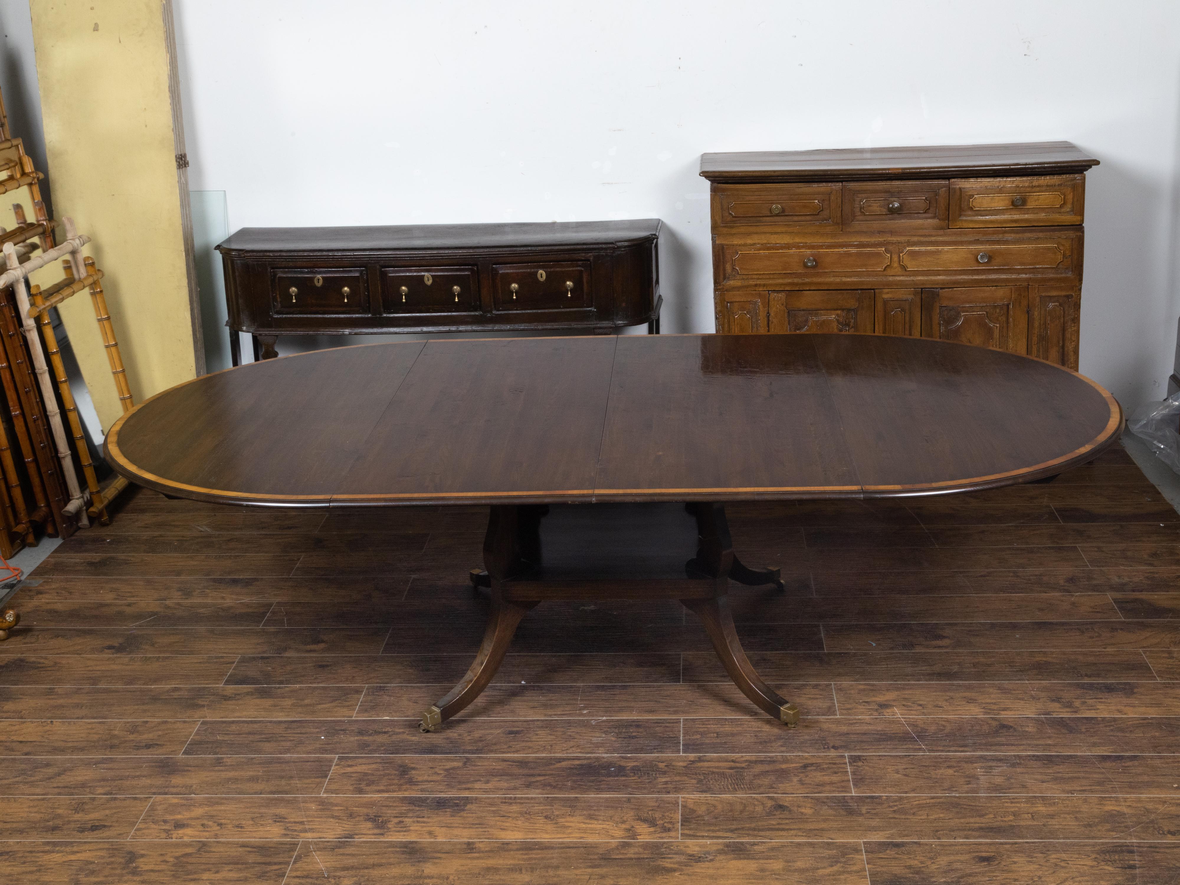 Brass Vintage English Oak Extension Table with Two Leaves and Four Legs on Casters For Sale