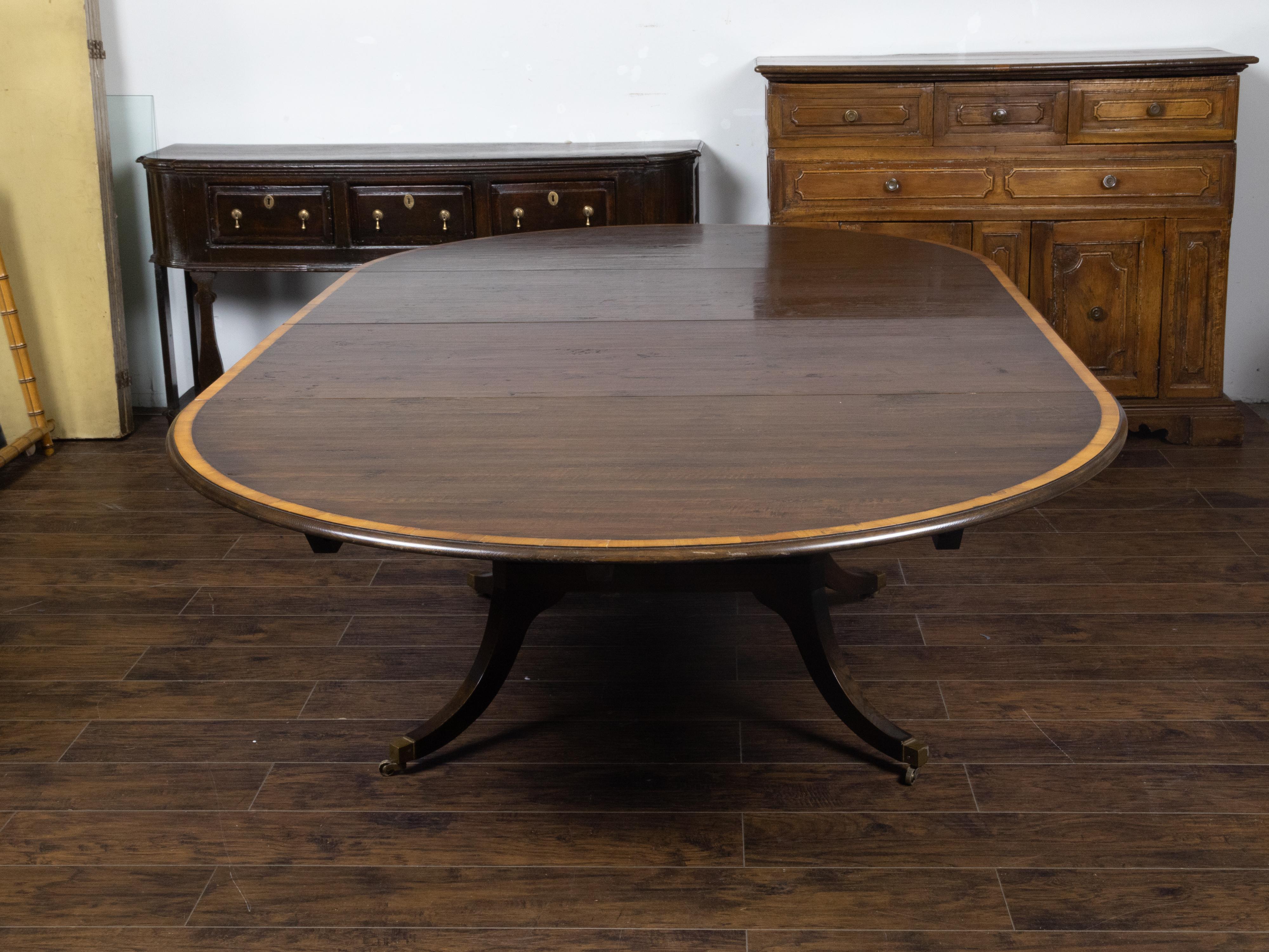 Vintage English Oak Extension Table with Two Leaves and Four Legs on Casters For Sale 2