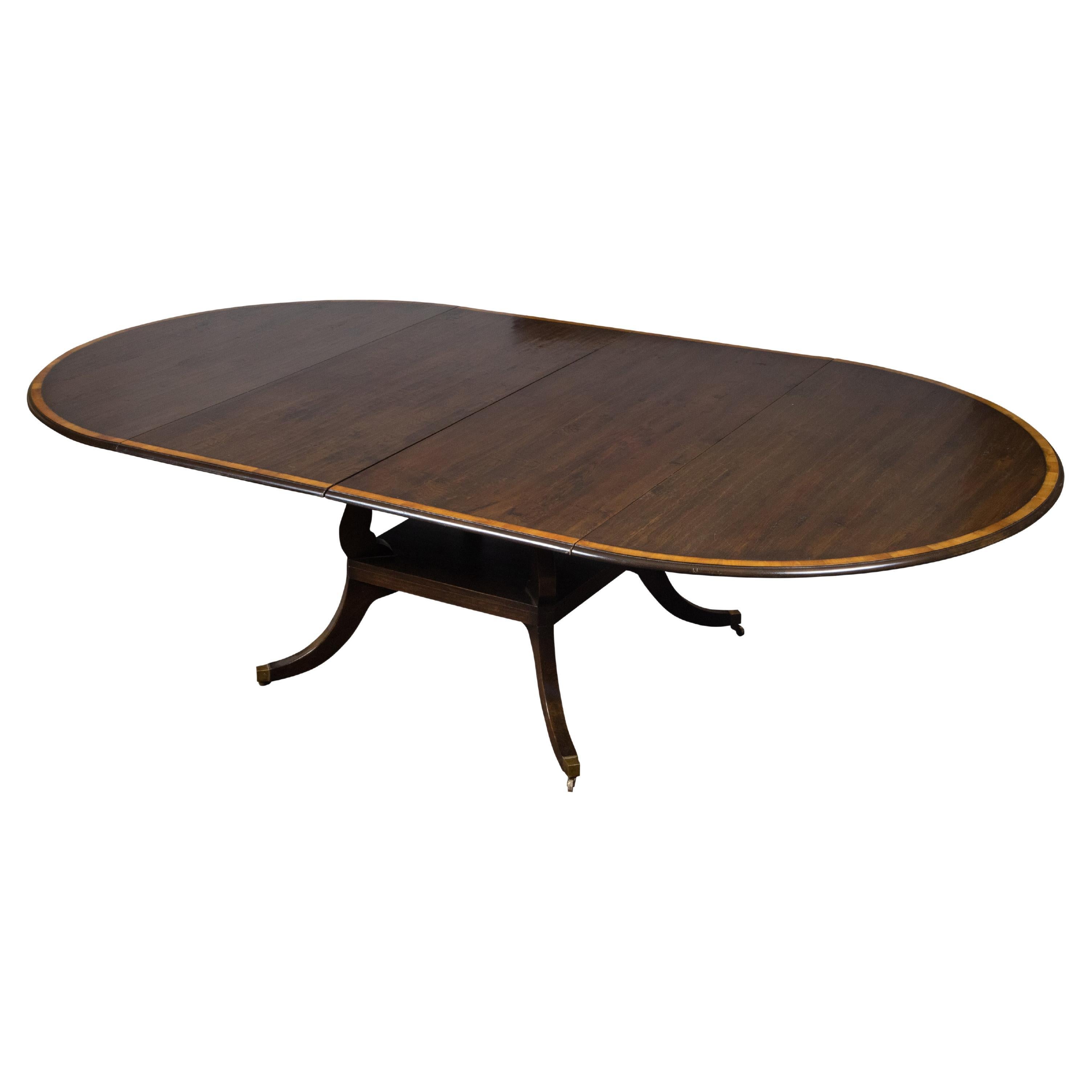 Vintage English Oak Extension Table with Two Leaves and Four Legs on Casters For Sale