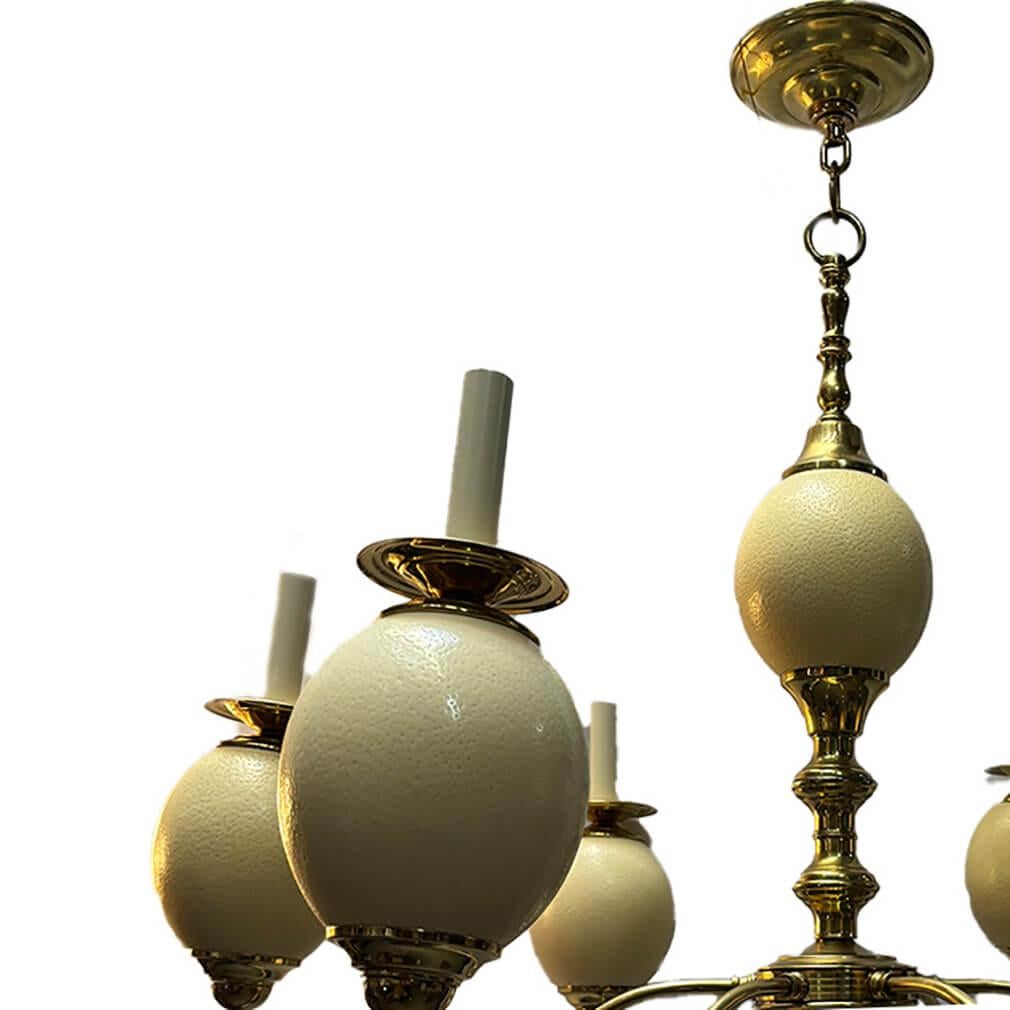 A circa 1960's English polished brass chandelier with ostrich eggs and 6 lights.

Measurements:
Diameter: 35.5