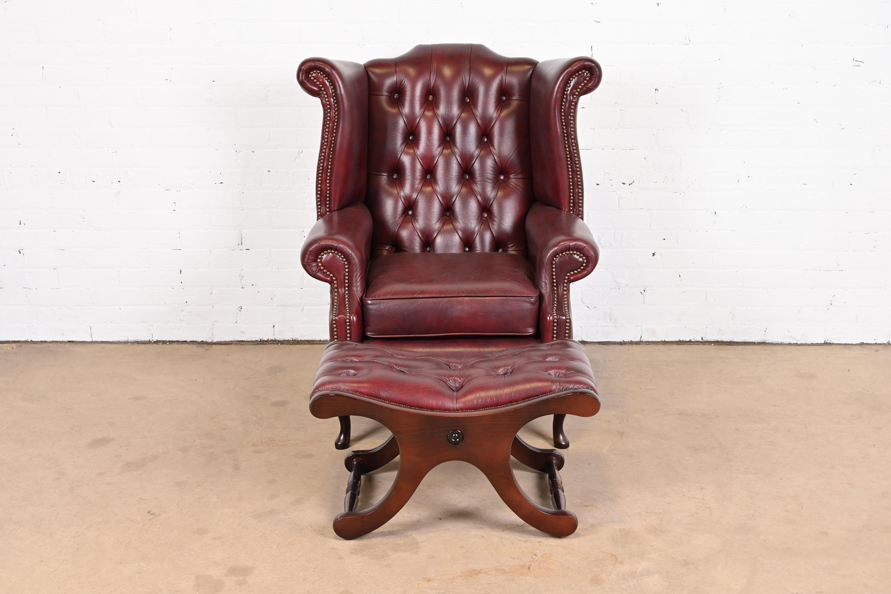 Vintage English Oxblood Leather Chesterfield Wingback Lounge Chair with Ottoman In Good Condition In South Bend, IN